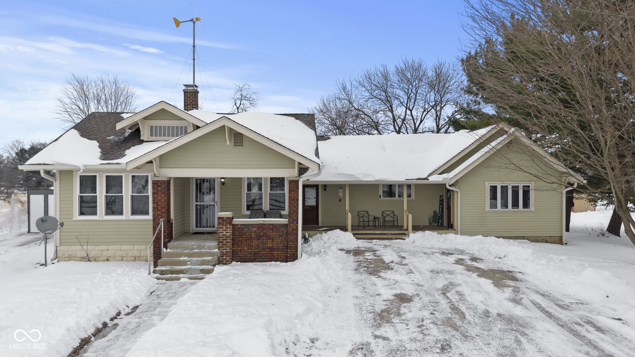 Set on 8.63 acres in Whiteland, this 3,157-square-foot property offers a rare combination of space, flexibility, and privacy-just minutes from major highways, shopping, and everyday conveniences. Designed for multi-generational living or adaptable use, the home is currently configured as a residence with separate in-law quarters, with the option to open the wall and create one seamless living space. The primary residence features three bedrooms, a full bath, a welcoming great room, kitchen with breakfast area, dining area, laundry, and an additional family room in the basement-ideal for entertaining or everyday living. The in-law quarters include a private primary bedroom, full bath, kitchen with breakfast area, office, laundry, and a spacious great room highlighted by a cathedral ceiling and loft, creating an open and airy feel. Outdoor living is just as impressive. A covered deck overlooks the in-ground pool and expansive acreage, offering peaceful views and plenty of room to relax, entertain, or enjoy the outdoors. An oversized detached two-car garage provides ample space for parking, hobbies, or a workshop. The property also includes a 75' x 50' pole barn equipped with three offices, two bathrooms, and a kitchen while keeping the shop area 65x50, making it ideal for a home-based business, storage, or creative use. Two additional outbuildings add even more storage and versatility. This one-of-a-kind Whiteland property delivers a true rural setting with the convenience of nearby interstates-perfect for buyers seeking land, flexibility, and room to grow without sacrificing accessibility.