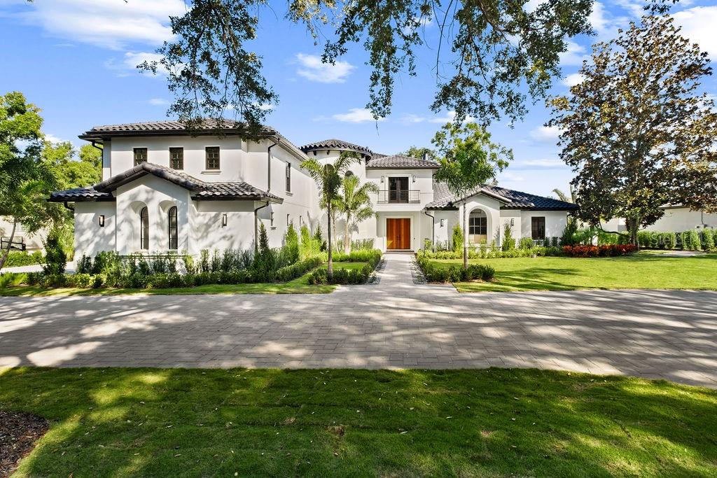 Private showings are easily accommodated, including same-day requests. Newly renovated and fully turnkey, this private Isleworth residence offers a rare balance of architectural authority, thoughtful design, and quiet indulgence.Spanning approximately 8,000 square feet, the home unfolds with intention. Rich walnut cabinetry and wood detailing create warmth and continuity throughout, while the fireplace and wine cellar anchor the living spaces with understated elegance. Every room feels deliberate, refined, and composed.The kitchen is a statement of both form and performance; finished with Taj Mahal quartzite countertops, a 60-inch Wolf gas cooktop, Dacor refrigerator and freezer, two warming drawers, a steam oven, and a discreet hidden pantry designed for seamless entertaining. Dual dishwashers and two laundry areas support effortless daily living behind the scenes.Designed for both privacy and flexibility, the home features six bedrooms, a dedicated office, a bonus room with a closet suitable as an additional bedroom, and an elevator for ease across levels. Bathrooms are equally considered, with five full and 2 half baths, all executed with a calm, modern sensibility.Outdoors, the residence enjoys full privacy and tranquil pond views, complemented by a gas-heated pool and jacuzzi, and summer kitchen; a serene backdrop for both quiet mornings and refined gatherings.Mechanically, the home has been comprehensively updated with four new A/C units (2025), two tankless water heaters, and recently replaced garage doors and motors, ensuring modern efficiency beneath the elegance.It is a residence restored with intention, where discretion, craftsmanship, and comfort converge.Private showings are easily accommodated, including same-day requests.