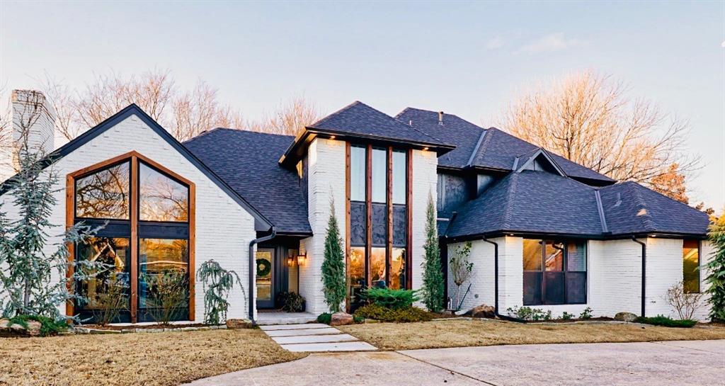 This stunning home in West Side Norman has been completely remodeled from top to bottom, offering a modern and luxurious living experience. Taken down to the studs and meticulously rebuilt, this four-bedroom, three-and-a-half-bath residence showcases all-new cabinetry, appliances, floors, walls, light fixtures, and upgraded hardware throughout. The kitchen is a chef’s dream, featuring designer light fixtures, a premium Z-line gas oven, spice and utensil pull-out cabinets, full-extension drawers with soft-close hinges, a built-in commercial refrigerator and freezer, tile extending to the ceiling, and abundant storage options. A 12-foot sliding patio door opens to a vaulted back patio, creating an inviting indoor-outdoor flow.Home is offered with a home warranty! Listing agent is seller. The living area boasts a beautifully tiled fireplace, striking beams, and custom built-ins, while the entry features a sleek glass front door and a new iron mailbox for added curb appeal. Upstairs, a spacious bonus room with built-in cabinets provides versatile space, including room for a wine fridge. The large master bedroom includes a wall of 9-foot windows that flood the space with natural light, as well as his-and-hers closets. The spa-like master bathroom features an oversized freestanding soaking tub and a herringbone-tiled shower with a seamless glass door. The home also includes a beautifully crafted wood staircase, numerous storage closets, and large windows throughout, ensuring an abundance of natural light. Exterior updates include all-new cedar accents, refreshed landscaping, and thoughtful design touches. This home is an absolute masterpiece, blending thoughtful design with exceptional craftsmanship in every detail. Broker owner License #151807