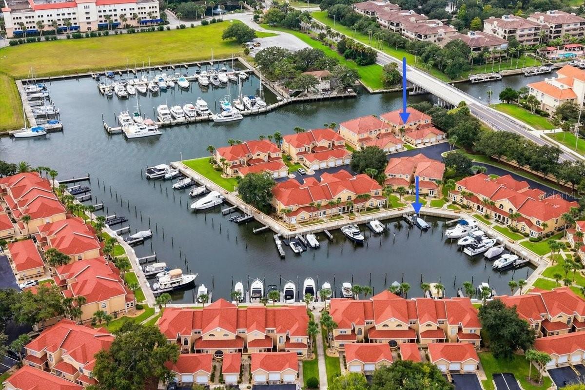 Waterfront End Unit with Spectacular Canal Views, Two Primary Suites & Boat Slip Available. Discover the perfect blend of waterfront beauty, boating convenience, and flexible living in this rare end-unit townhome located in the highly sought-after gated community of Marina Cove.Offering approximately 2,500 square feet of light-filled living space, this exceptional residence features stunning saltwater canal views, a private courtyard entrance, a two-car garage, and the opportunity to purchase a large private boat slip separately.A gated paver walkway leads to a charming front and side courtyard, creating a welcoming first impression and added privacy. Inside, expansive living and dining areas are filled with natural light and designed to capture breathtaking waterfront views from nearly every angle.The brand-new kitchen is a standout feature, offering abundant cabinetry, a built-in pantry wall with pull-out shelving, generous counter space, and an open layout ideal for everyday living and entertaining. From the kitchen, dining area, and living room, enjoy sweeping views of the wide main saltwater canal and long-range vistas toward the Intracoastal Waterway.Triple sliding glass doors open to a covered screened lanai overlooking the water, seamlessly connecting indoor and outdoor living. Step outside to the waterfront patio and enjoy morning coffee, evening sunsets, or simply watching boats glide by.The thoughtfully designed floor plan offers the possibility of two primary suites. The main-level primary suite provides comfort and privacy with an en-suite bath and spacious walk-in shower. Upstairs, a second bedroom suite with its own en-suite bath creates an ideal retreat for guests, extended family, or multigenerational living.A large additional flex space offers endless possibilities as a home office, media room, fitness area, guest retreat, or potential additional bedroom configuration. There is also the possibility of adding another bathroom, subject to applicable approvals and permitting.As a desirable end unit, the home enjoys extra windows, enhanced privacy, and abundant natural light throughout.Residents of Marina Cove enjoy a true resort-style waterfront lifestyle with access to a protected marina, community pool, clubhouse, tennis and pickleball courts, putting green, scenic walking paths, gazebo, and waterfront gathering areas. Enjoy front-row views of Palm Coast's beloved Holiday Boat Parade and even rocket launches from Cape Canaveral.Located in Marina Cove Landings, the newest section of the community and home to some of Marina Cove's largest floor plans, this property is just minutes from European Village, popular restaurants, shopping, entertainment, and the Sunday Farmers Market.Whether you're seeking a waterfront residence, seasonal retreat, or boating lifestyle home, this rare Marina Cove opportunity offers spectacular views, exceptional flexibility, and one of Palm Coast's most desirable waterfront locations.