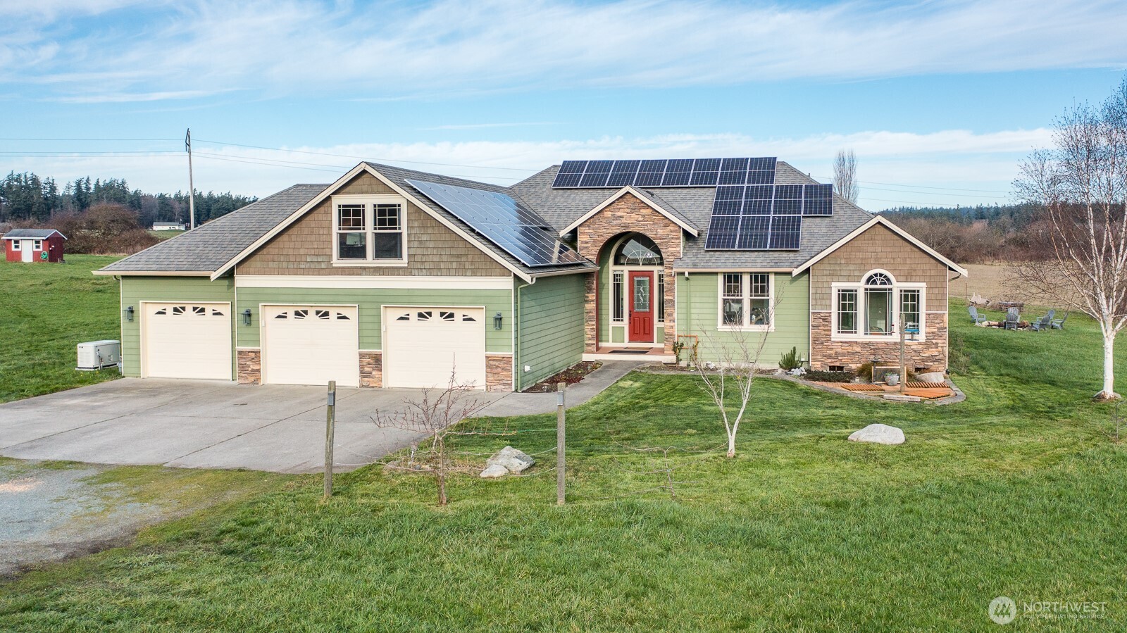 Set on 4.92 acres of open, lush greenery, this property offers the serenity of country living just minutes from the city. Step through the grand entryway to be greeted by soaring ceilings and wall to wall windows that fill the home with natural light. The oversized living room flows seamlessly into the stunning kitchen, featuring expansive granite countertops, stainless steel appliances, and a generous center island. An adjacent informal dining area is beautifully framed by bay windows. The spacious primary suite includes a relaxing jetted tub and a large walk-in closet. Above the garage, a finished bonus room provides the perfect space for a home office, studio, or hobbies. Outside, two separate patios invite you to relax and enjoy your private retreat. Additional upgrades include a wired natural gas generator, a heat pump, in addition to a natural gas furnace, for year-round comfort, and solar panels that keep electric costs nearly zero. A rare opportunity to enjoy space, privacy, and convenience in one exceptional property.