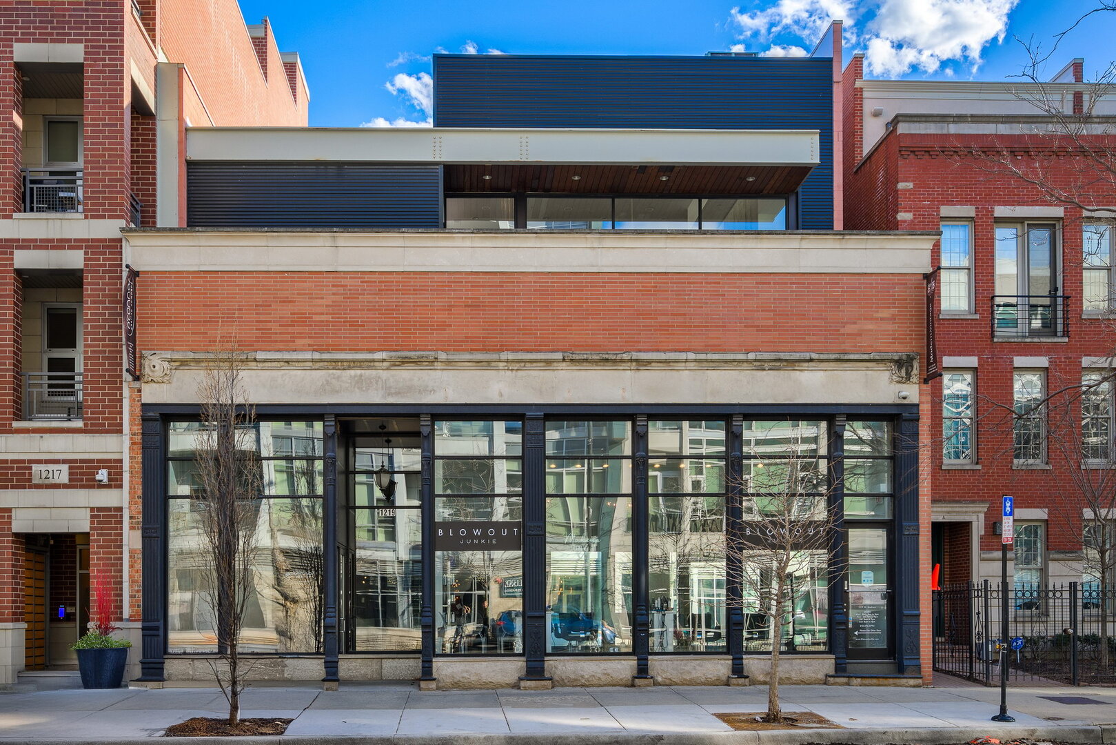 ESTABLISH A SIGNATURE PRESENCE IN THE HEART OF CHICAGO'S PREMIER WEST LOOP DISTRICT WITH THIS ONE-OF-A-KIND BUILDING. A truly irreplaceable opportunity to secure a flagship location on coveted Madison Street. This exceptional, ADA-compliant steel-frame mixed-use asset offers approximately 4,000 square feet of customizable commercial space with dramatic 17.5-foot ceilings, complemented by an extraordinary 4,000-square-foot luxury penthouse "flex space" residence above. Situated on a rare double lot, the property offers an exceptional combination of visibility, flexibility and accessibility, featuring a 4,000-square-foot lower level, private courtyard/patio and nine secured on-site parking spaces, an increasingly rare amenity in the West Loop. Strategically positioned within one of Chicago's most dynamic and rapidly growing commercial corridors, the property benefits from outstanding transportation connectivity, strong pedestrian traffic, and immediate proximity to the neighborhood's renowned restaurants, retailers, offices, and residential developments. The first level is ideally suited for a corporate headquarters, flagship showroom, medical or wellness practice, family office, creative studio, experiential retail concept, or other distinguished professional use. Designed with flexibility in mind, the first-floor space can be fully customized to align with a tenant's operational needs, brand identity and long-term vision, offering a rare opportunity to create a truly bespoke environment tailored to your business. Your vision, brought to life your way. Accessible via a private elevator, the never-occupied penthouse residence delivers a level of luxury seldom found in an integrated live-work environment. The residence features three bedrooms, three-and-a-half baths, soaring 17.5-foot ceilings, premium designer finishes, advanced smart-home technology and an expansive open-concept great room anchored by a dramatic floor-to-ceiling book-matched marble fireplace. Additional highlights include a chef's kitchen with an oversized Taj Mahal quartzite island, a spa-inspired primary suite with radiant heated flooring and a substantial private terrace designed for sophisticated entertaining. Whether used for business or housing it is a showstopper. This is a rare opportunity to combine executive living and professional operations within one architecturally distinctive asset, offering a unique blend of prestige, functionality and lifestyle in one of Chicago's most sought-after neighborhoods.