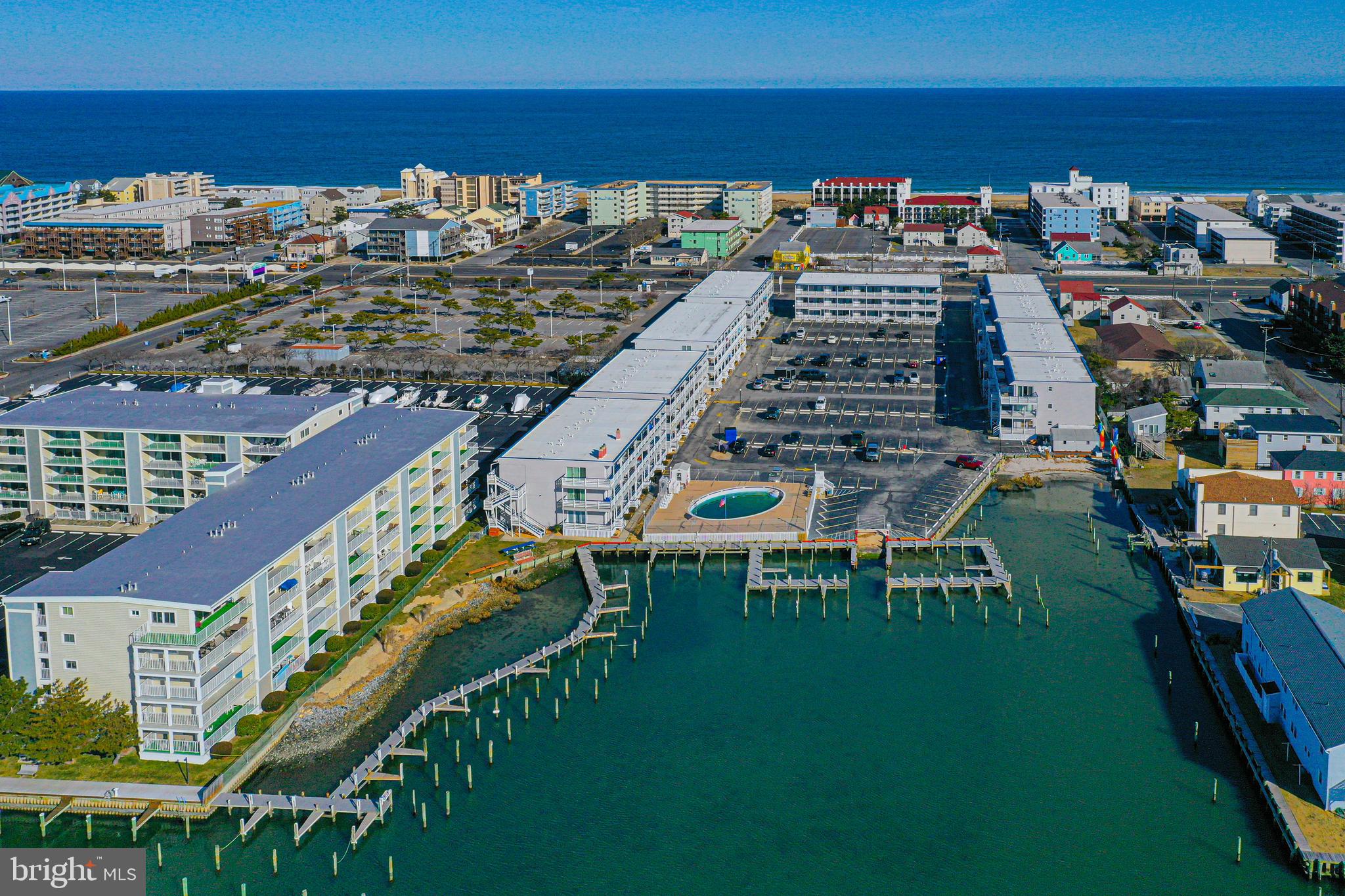 Don’t miss this beautifully updated 1 bedroom, 1 bath end unit located on the second floor, filled with natural light and coastal charm.This condo features an updated kitchen with upgraded countertops and stainless steel appliances, newer flooring throughout, and the convenience of a full-size front-loading washer & dryer perfect for easy beach living.Step outside and you’re just a short walk to the beach or over to the bayfront pool… plus boat dock with slips available for those who love being out on the water. End units rarely come on the market, and this one delivers with stunning sunsets and that bright, airy feel everyone wants.Centrally located, you’re just minutes from the Ocean City Boardwalk, restaurants, shopping, and all the Ocean City nightlife just walk right from your condo and enjoy everything OC has to offer.Whether you’re looking for a beach getaway, investment, or both… this one checks all the boxes. Ocean City living at its best don’t wait on this one!