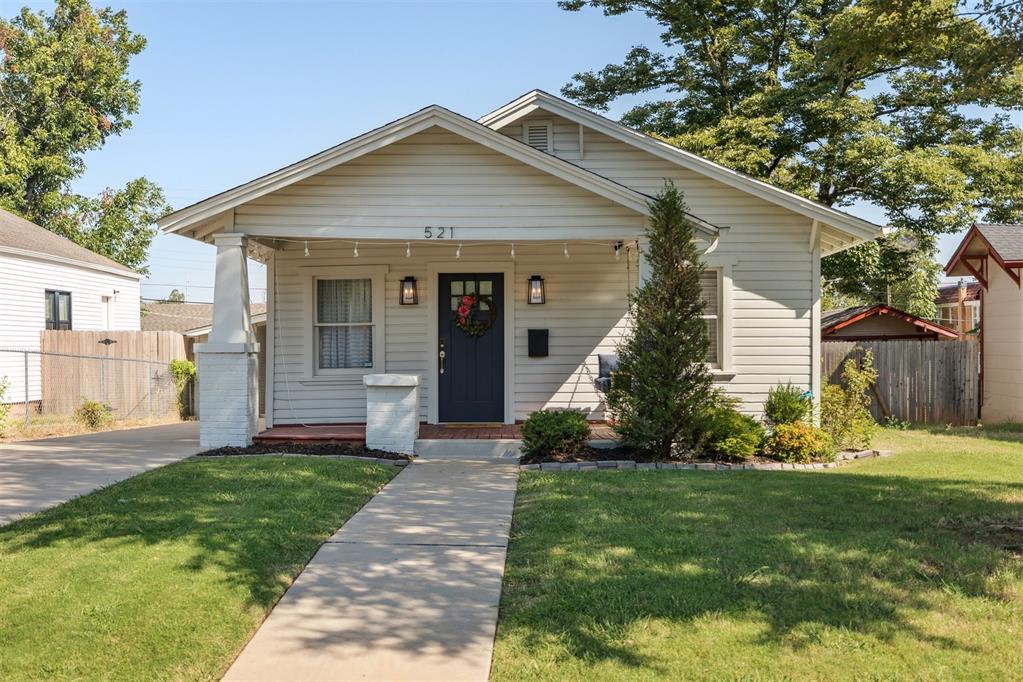Charming move-in ready Bungalow in the Paseo Arts District.  Recent updates include new exterior paint, landscape, garden, fence, tree trimming and seeded front and backyard.  Interior upgrades include new paint for kitchen cabinets, coffee bar, and laundry room.  New carpet, blinds/curtains, light dimmers and washer and dryer.  This house is as cute as they come in this area.  Walk to shops, restaurants, bars and enjoy all that the Paseo neighborhood has to offer.