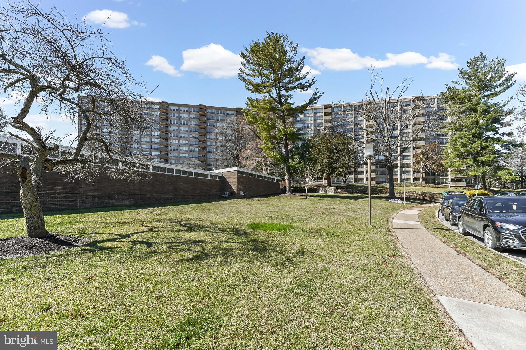 Bright & sunny 6th floor condo at Greenhill with beautiful views of the pool and grounds! Newly renovated common areas and hallways greet you as you enter the unit. This unit is situated within a fabulous location in the building, high enough to get lots of sunlight in the summertime and just close enough to the elevators for easy access. There's a spacious open living/dining area, an updated kitchen with stainless steel appliances, two spacious bedrooms (one with en suite bath) and two full bathrooms. Abundant closet space plus an in-unit washer and dryer (included). The East facing private balcony overlooks the beautiful grounds and is perfect for watching sunrises with your morning coffee or tea and listening to the birds, perched just above the treetops.The Greenhill condominium sits on 23 beautifully landscaped acres with indoor and outdoor pools, tennis courts, playground and walking paths. There are tons of amenities including a front security gate, 24/7 doorman, onsite management, social rooms and library. The Green Hill shuttle service is available to residents for easy access to shopping centers, grocery stores, Lankenau Hospital and the R5 train station to Center City.Live a maintenance free lifestyle at Greenhill Condominiums where the monthly condo fee covers all utilities (except for cable TV/Internet), maintenance, parking, security and groundskeeping. There's a small additional fee for use of the outdoor pool, indoor pool located in the West building and gym. The social club sponsors trips to the Kimmel Center, theaters and other regional cultural events. Award winning Lower Merion school district - property is located in a high school choice zone for either Lower Merion or Harriton. Don't miss this fabulous unit in a prime location!