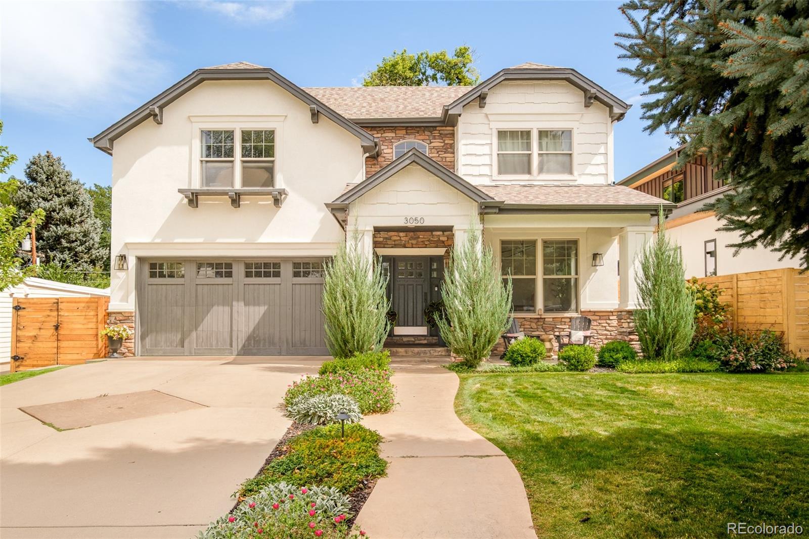 Welcome to 3050 S Bellaire Street, a beautifully reimagined residence in the heart of Denver’s sought-after University Hills neighborhood. This home was built in 2007 and has undergone a thoughtful, design-forward remodeled where every detail was carefully curated - from stunning finishes and designer fixtures to a sophisticated palette of gorgeous paint colors that create a cohesive, elevated feel throughout. The main floor makes an unforgettable first impression with a welcoming foyer centered around a gorgeous winding staircase that immediately sets the tone. Just off the entry, a versatile front bonus room offers the perfect space for a home office, study, or playroom. A dedicated dining room is ideal for entertaining and connects seamlessly to the kitchen through a stylish butler’s pantry, adding both beauty and function. The kitchen is truly the heart of the home: beautifully designed and flowing effortlessly into the family room, where large windows and backyard access make the space ideal for everyday living and gatherings alike. A serene powder bathroom completes the main level with spa-like calm and refined finishes. Upstairs, the home continues to impress with a spacious primary suite featuring a large walk-in closet and a luxurious ensuite bathroom. Three additional bedrooms, a well-appointed laundry room, and a versatile loft space provide flexibility for guests, work, or relaxation. The finished basement expands the living space even further, offering a large recreation room perfect for movie nights or game days, a built-in bar area for entertaining, a full bathroom, and two additional bedrooms. This home enjoys tree-lined streets and easy access to parks, trails, and everyday conveniences. The neighborhood is known for its proximity to popular shopping and dining destinations, with quick access to I-25. This is a rare opportunity to own a thoughtfully remodeled home that seamlessly blends timeless design, modern comfort, and an exceptional location.