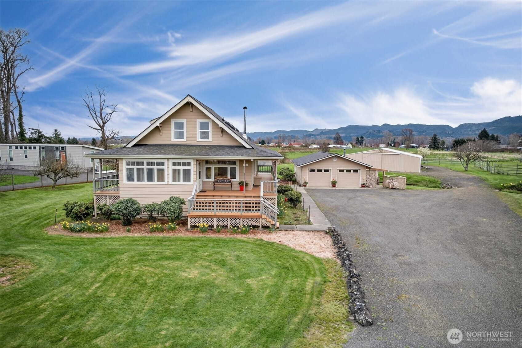 Set against the backdrop of the mighty Columbia River, this property offers the perfect blend of comfort, functionality, and natural beauty. Fully renovated in the late 1990s, the historic home feels fresh and move-in ready, with a large wrap-around porch perfect for morning coffee. Inside, you'll find a spacious kitchen with an island and dining area. Stay cozy by the wood stove in the living room and enjoy practical touches like the main-level laundry and ramp for easy access. A full basement includes a wine cellar and built-in storage. The detached two-car garage is complete with a workshop, woodstove and custom storage closets. Stroll past the greenhouse and duck pond to the large, fenced garden area with mature fruit trees and berries, perfect for the hobby gardener or self-sufficient lifestyle. The possibilities are endless with a spacious 48’ x 48’ fully enclosed barn ready for RV storage, equipment, or animals. Step across the road to your own private dock on Welcome Slough with immediate boat access to the Columbia River for fishing and recreation. Moor your boat on the 103’ dock, or keep it covered in the boathouse. The lift house with hoist is sturdy and ready for your work or play. Spend your days spotting bald eagles, osprey, and deer right from your porch or while exploring the area by boat. Whether you're casting off for a day on the river, tending the garden, or simply unwinding in this serene setting, this property delivers a true slice of Pacific Northwest.