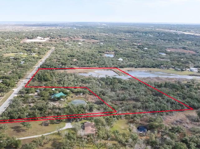 8.2+ Acres in Peninsula Oaks – A Rare Find! Nestled in the heart of Rockport, this stunning 8.2-acre property is a nature lover's dream. Towering, mature trees provide beauty and privacy, creating the perfect setting for your dream home or investment. With plenty of space to spread out, the possibilities are endless! Enjoy the peaceful coastal lifestyle while being just minutes from town, the water, and all that Rockport has to offer. Don't miss this rare opportunity—come see it today!