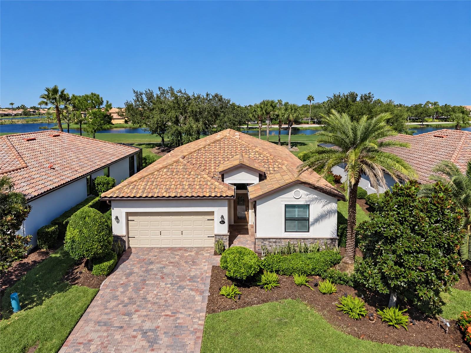 Golf course views, an updated kitchen, and an oversized screened lanai make this immaculate, move-in-ready River Strand home an inviting choice for year-round or seasonal living. Overlooking the Sanctuary golf course, the lanai offers a spacious setting for morning coffee, while  enjoying the colors of sunrise and sunset.Inside, the open-concept floor plan makes everyday living and entertaining easy. The kitchen was updated in 2023 with stylish finishes and appliances, while plantation shutters throughout add a polished designer touch. All four bedrooms feature engineered hardwood flooring. Double doors to the fourth bedroom allow flexible use as an office, den, or flex room. A guest bedroom with an ensuite bathroom provides added comfort and privacy for overnight visitors or multigenerational living.The SOCIAL Membership opens the door to an exceptional array of amenities, with golf available on a pay-per-play basis, subject to availability. Enjoy two resort-style pools—one with a full-service bar and grill and patio seating, and another with a covered picnic area—plus six satellite pools throughout the community. Nine Har-Tru tennis courts and eight pickleball courts offer opportunities for recreational and tournament play, with beginner lessons and a pro shop for equipment. Two fitness centers offer exercise equipment and a variety of classes, with additional instructor fees for select offerings. A community center provides space for private parties and community events.Dining options range from indoor clubhouse seating in the Strand to full-service dining on the Terrace, with varied menus and happy hour specials. Catch NFL games at the bar and grill or gather with friends for a leisurely dinner.Within the Heritage Harbour master community, the Marketplace and the Landings offer convenient shopping and dining, including Costco, Target, Hobby Lobby, Whole Foods, Aldi, Seasons 52, LongHorn Steakhouse, Chick-fil-A, pizza restaurants, and more. Medical facilities, international airports, and the University Town Center area are within reach, while the beautiful Gulf Coast beaches of Bradenton and Sarasota await to the west.Schedule your showing and discover how comfortably this home brings together indoor living, outdoor enjoyment, and the River Strand lifestyle.