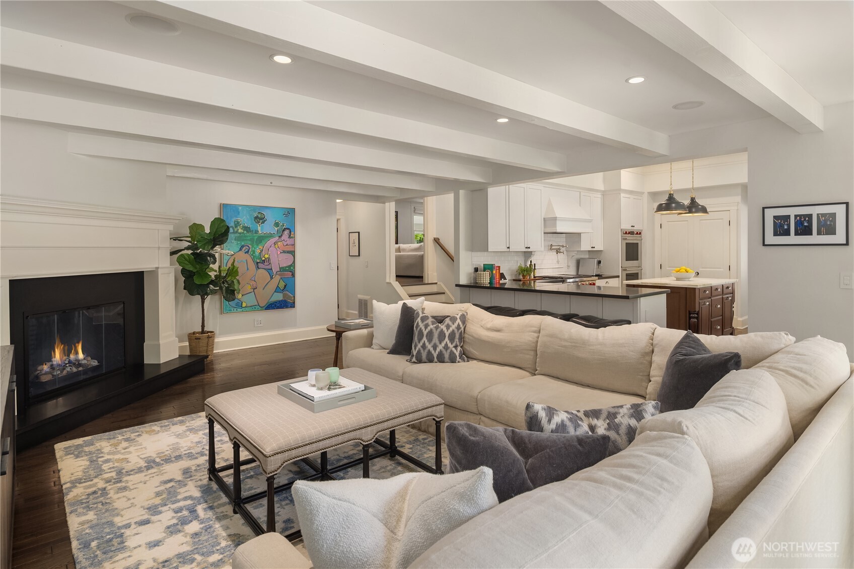 Family room sectional gathers around a cozy gas fireplace