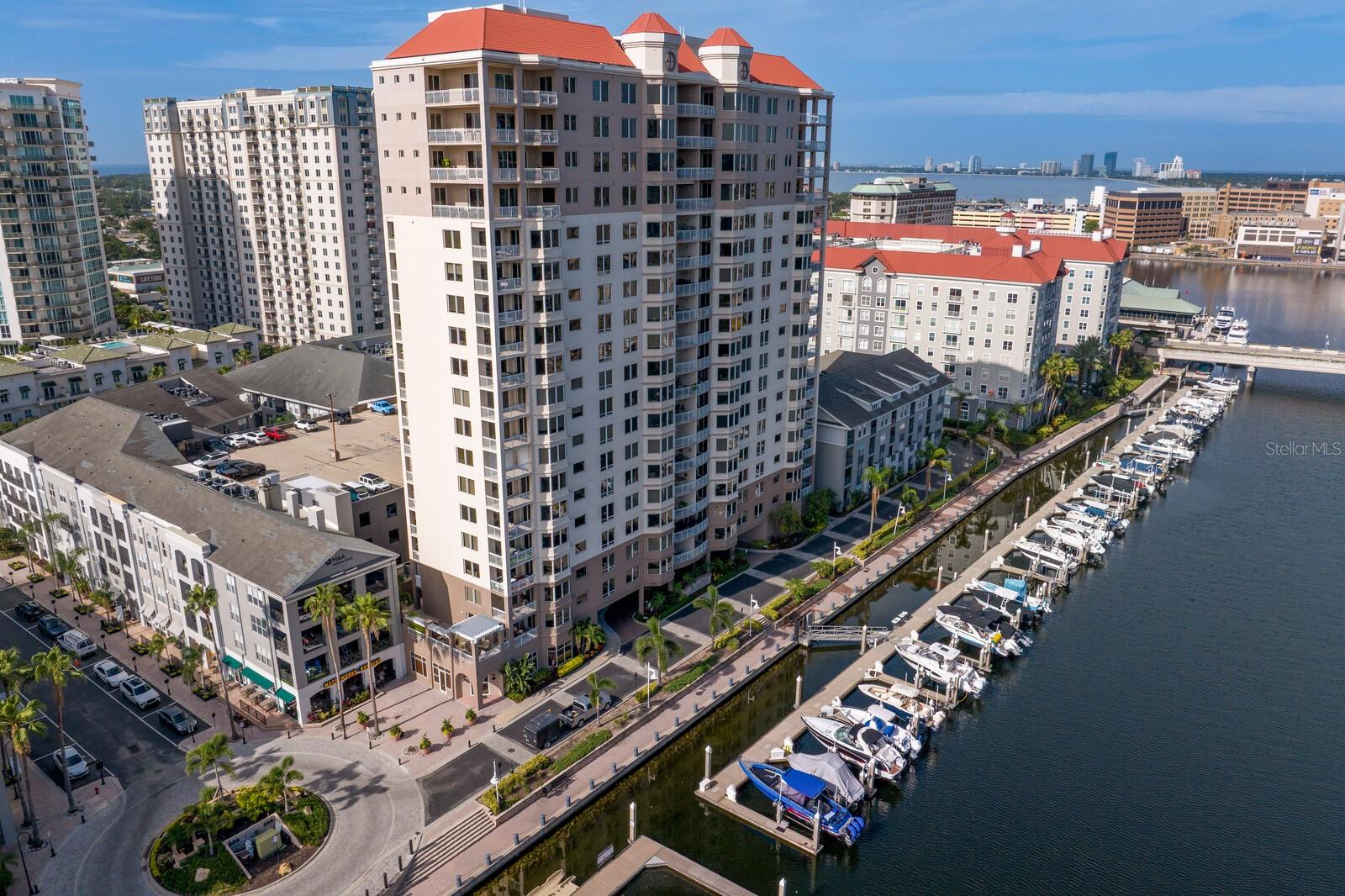 Under contract-accepting backup offers. Experience elevated living in one of Tampa’s most exclusive addresses — The Grandview on Harbour Island. This 11th-floor, newly remodeled condominium offers 2,259 square feet of refined space, thoughtfully designed for comfort, privacy, and panoramic views. Step inside to discover a modern, open layout featuring brand-new light oak flooring and high-end appliances, including a Wolf induction cooktop, Thermador refrigerator and dishwasher, and KitchenAid microwave. Walls of glass frame uninterrupted views of the channel, Downtown Tampa, and vibrant Water Street, while two private balconies invite you to soak it all in. This residence features a split-bedroom floorplan for optimal privacy. The spacious primary suite offers its own south-facing balcony, a spa-like en suite with dual vanities, frameless glass shower, separate soaking tub, water closet, and a custom walk-in closet. The second bedroom also enjoys a southern exposure and private en suite, while the third bedroom faces north, capturing the same stunning water views as the main living area. With only 64 residences across two towers, The Grandview offers exceptional privacy and exclusivity. Each tower is served by its own elevator, with just two units/floor—meaning you share your hallway with only one neighbor.  Each unit includes a rare 5' x 12' climate-controlled storage room just outside your front door and two oversized, assigned parking spaces in the gated garage directly behind the building. Monthly fees include access to four pools, a fully equipped fitness center, 7-day-a-week concierge, and building maintenance — all part of a well-managed and responsive association. Just steps from your door, enjoy walkable access to Harbour Island’s top dining and daily conveniences—including Jackson’s, American Social, a neighborhood market, dry cleaners, a pet boutique, and the new Life Time Fitness complex with tennis, pickleball, pools, and full-service wellness amenities. You're also just moments from Amalie Arena, Sparkman Wharf, and the Tampa Cruise Terminal—placing you in the heart of Tampa’s most vibrant waterfront district. This is more than a home — it's a lifestyle. Welcome to The Grandview 1104.