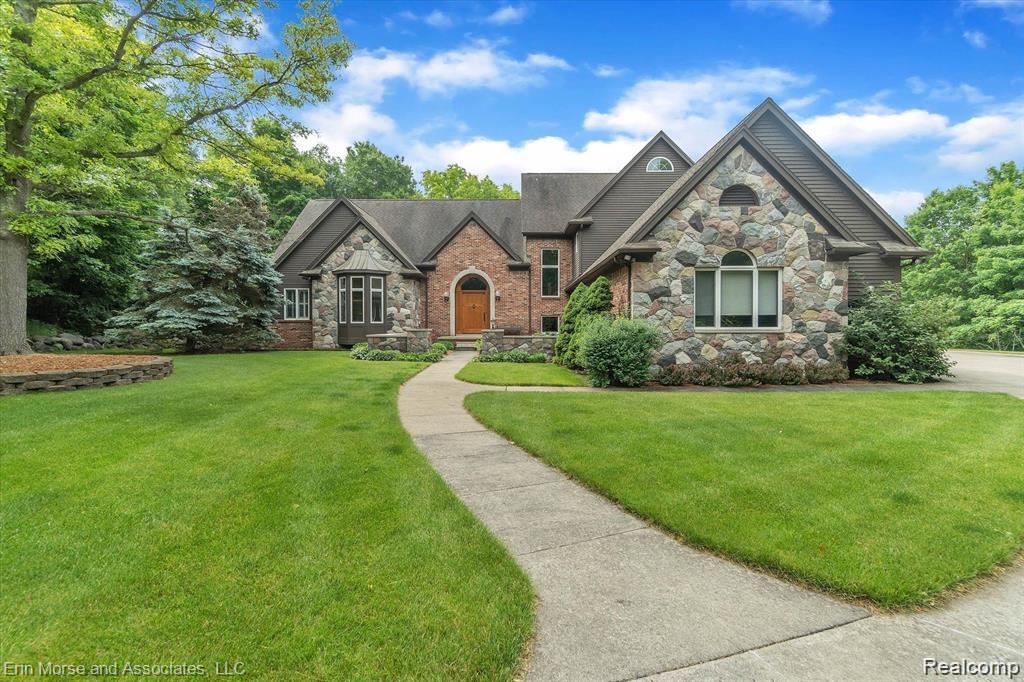 Welcome to living in the country in Metamora Hunt.  This Estate home features 4 bedrooms, 4.5 baths, and many recent upgrades to the home; Main floor primary bedroom w/bathroom suite, along w/large walk-in California closets cabinetry.  Great Room w/cozy fireplace, new shiplap/recessed lighting w/beamed ceilings; wood burning stove with blower to fireplace; Outdoor electrical to sauna or hot tub; covered outdoor deck w/gas plumbing for a bbq hookup;  this private home is privately situated on 30 acres of a park like setting, with a circular driveway, approximately. 3200 sqft outbuilding and attached 5 stall barn; large hay loft area; 3 water spigots; heated;  Trails are located through the property, and also hooks up to an extensive community trail system.  There is an approx. 3 acre fenced pasture, approx 80x160 newly renovated outdoor horse arena (still being completed due to weather or can give a credit to complete); lean to and separate fenced area; lots of grassy area and beautiful flower/plants abound.  The entertaining kitchen features lots of wood cabinetry, stainless steel appliances, walk-in pantry, laundry room and side entrance to the home.  3 car attached garage (one bay is heated); sprinkler/irrigation system; two wells on the property; septic system w/leach field;  the basement features a large living room area with fireplace, game/pool table area, surround sound, large wet bar w/wine cooler and microwave, gym room w/padded flooring (or second office); and two utility/storage rooms.  Outdoor lighting in-ground in front and back of home; two HVAC and AC units; tankless water heater; garbage disposal; reverse osmosis system; water filtration system; water softener system owned upgraded electrical to house; whole house generator which also powers the barn; new diesel tank. Sellers have lots of new farm equipment for sale, perfect for maintaining property (tractor, ATV, bobcat, excavator, etc).