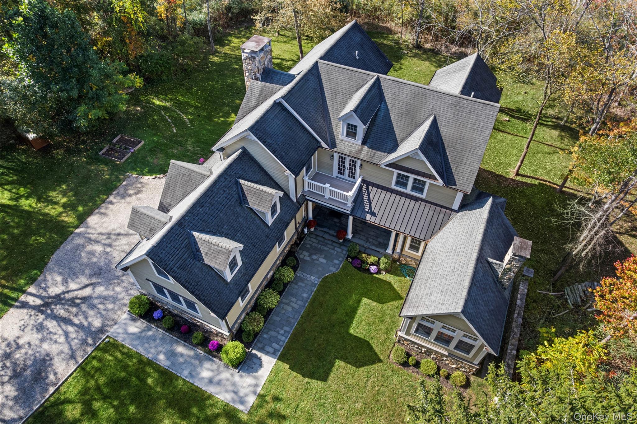 Welcome home to this exquisitely crafted and meticulously maintained colonial, perfectly set on 9 acres of serene natural beauty—offering the comfort, elegance, privacy and charm you’ve been searching for! 

Step through the grand mahogany doors and discover a spacious living room with a fabulous fireplace, an elegant dining room ideal for holiday gatherings, and a stunning French Country kitchen with a massive center island. The kitchen seamlessly opens to a spectacular family room, where a fireplace and coffered ceiling add an extra layer of sophistication to this custom home.

Just off the kitchen, you’ll find both a butler’s pantry and food pantry—perfect for staying organized whether entertaining or enjoying everyday living. Additional conveniences include a powder room, mudroom and a separate laundry room with abundant cabinetry and a utility sink, copper gutters, and a large two car garage with custom mahogany garage doors. 

Up the grand stairway awaits 3 generously sized bedrooms and an additional bonus room, a library, and 3 full bathrooms—designed to accommodate the whole family. This spacious home lives like a 4 bedroom. The primary suite feels like a spa retreat, featuring tray ceilings, French doors leading to a private balcony, two large closets, and a luxurious bath with double vanity, jacuzzi tub, and shower.

Outdoor living is equally impressive, with two large balconies accented with Azek trim and cedar, a romantic Juliet balcony, and a stunning covered side porch. Whether you’re looking to enjoy your morning coffee, enjoying an evening glass of wine, or hosting lavish parties, this property offers all the outdoor space you can dream of. 

Throughout the home, you’ll find abundant windows filling each room with natural light, plus plentiful closets, built-ins, and storage. Award-winning schools, tranquil neighborhood, central air conditioning, and exquisite exterior stonework are just a few of the many additional perks.

This exceptional property truly checks every box. Don’t miss the opportunity to make it your forever home!