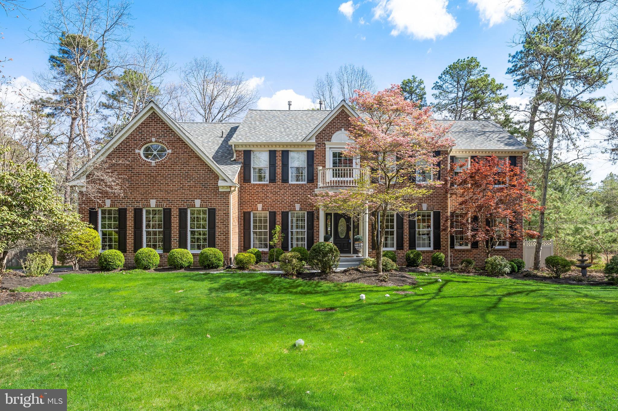 Set on a breathtaking 2.77-acre stream-front lot, this exceptional home offers the perfect blend of privacy, elegance, and modern sophistication. Completely updated with meticulous attention to detail, every inch of this home reflects refined craftsmanship and thoughtful design. The heart of the home is a stunning, fully renovated kitchen featuring sleek quartz countertops, designer tile backsplash, and high-end finishes— perfect for both everyday living and entertaining. The primary suite is a true retreat, highlighted by a spa-inspired bath with a soaking tub, and oversized shower.  Additional living space abounds with a beautifully finished basement complete with a gym, pool table, entertaining areas—ideal for guests, and recreation.  An inviting sun-drenched sunroom is a great place  to relax and take in the serene natural surroundings year-round. Recent upgrades include a new roof and siding (2024), offering both peace of mind and enhanced curb appeal. Step outside to your own private oasis featuring a professionally designed paver patio and tranquil koi pond. Enjoy a short walk down a private path to a picturesque stream. With approximately 4,000 square feet of living space, 4 bedrooms, and 3 1/2 bathrooms, this home is a lakeside retreat. Experience the rare opportunity to own a home that combines timeless architecture, modern amenities, and an unparalleled lifestyle in one of Medford’s most prestigious and sought after neighborhoods. With the added convenience of a whole-house generator and an exceptional setting, this home delivers luxury living at its finest. See floor plan for more accurate measurements.