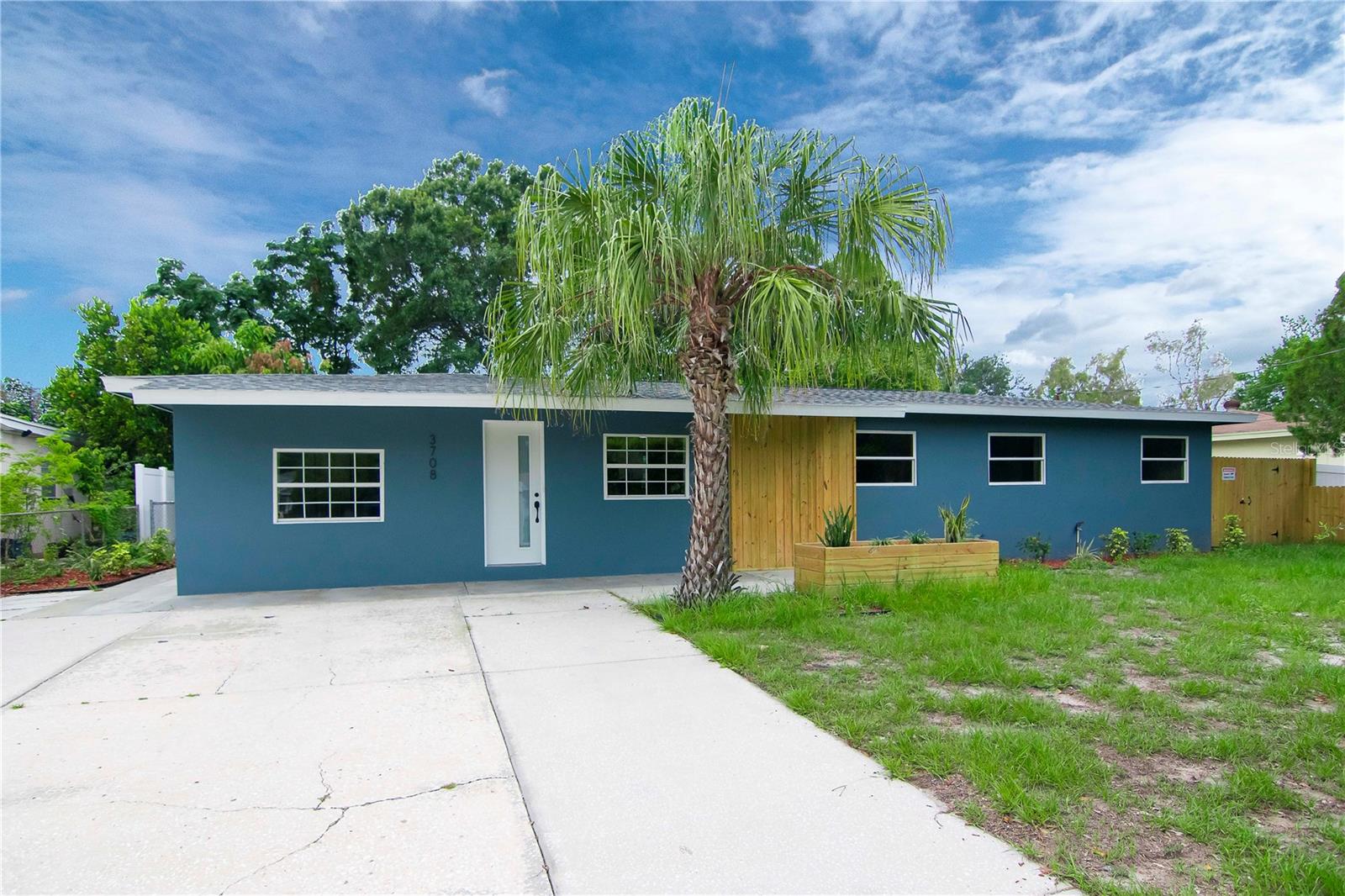 Updated & convenient location. Nestled in the heart of South Tampa, this stunning 5-bedroom, 2 bathroom home is an absolute gem. Step inside and be greeted by an open & bright living room, providing a great space to entertain. The fully renovated kitchen hosts pristine cabinets, quartz countertops, and stainless steal appliances. On the left side of the home, you'll find a conveniently located laundry room and access to your backyard. One bedroom sits separate from the rest, & is over-sized with built in closet. On the opposite side of the home are three additional bedrooms, a full guest bathroom with tub, and a primary bedroom featuring an en-suite bath. Don't forget to explore the expansive, FULLY fenced backyard, complete with storage sheds and an additional parking space.