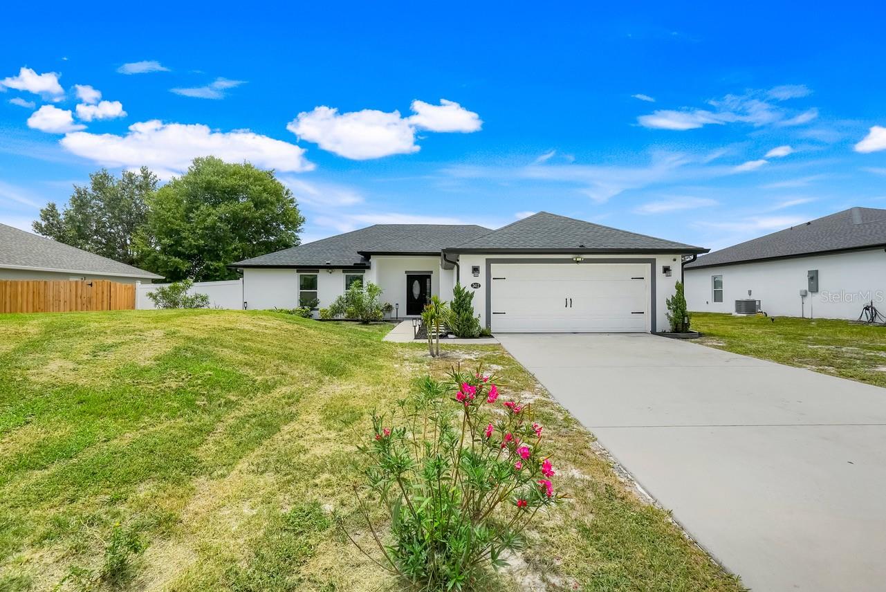 Seller is offering a 1-year home warranty at closing, and the Seller is leaving the house completely furnished for you!!!!Welcome to this captivating 3-bedroom, 2-bathroom home built in 2021, offering 1,633 sq. ft. of elegant living space and loaded with modern upgrades throughout. Located in a quiet neighborhood in Deltona, this beautifully maintained property features an open floor plan, perfect for both everyday living and entertaining. Step into a welcoming foyer that flows into a spacious living room, complete with a coat closet and ambient movie lighting for cozy nights in. The gourmet kitchen is a true showstopper, featuring Granite island with breakfast bar, Soft-close drawers, Stylish pendant lighting, Eye-catching backsplash and Coffee bar/wine bar for your morning brews or evening pours. The primary suite offers a relaxing retreat with a ceiling fan, movie lighting, dual walk-in closets, and a bathroom with granite countertops and a large walk-in shower. On the opposite side of the home, you’ll find the second and third bedrooms, both with ceiling fans, and a conveniently located hall bathroom. Additional features include Bonus room, air-conditioned laundry room, Crown molding and paned windows throughout. Large, screened lanai with two ceiling fans, Fenced-in backyard for privacy, complete with a shed, and Gutters already installed. This home truly has too many upgrades to list and is a must-see for buyers seeking comfort, and style. Located just minutes from shopping, dining, and easy access to I-4—perfect for commuters! Enjoy this suburban lifestyle along with close access to beaches, parks and nature trails. Can you believe all of this and NO HOA!!!!!!