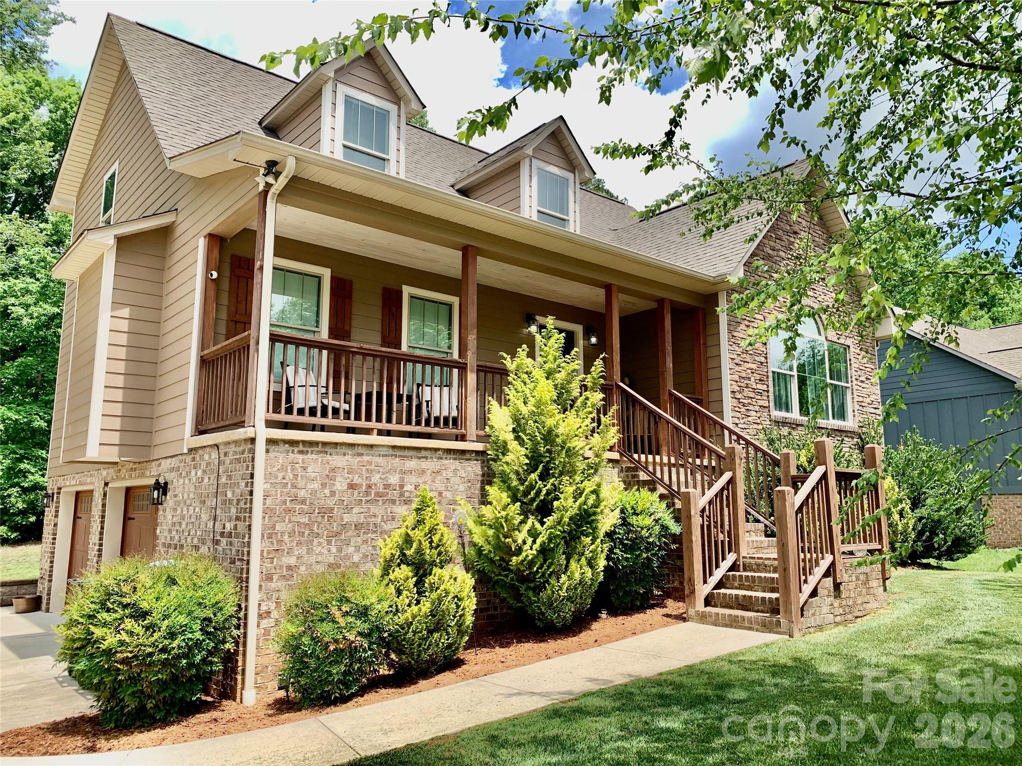 Gorgeous one-and-a-half story Craftsman-style home featuring 3 bedrooms and 2.5 baths in the sought-after Maplewood Village subdivision of Hudson. The main level offers a spacious open floor plan with towering cathedral ceilings, a cozy gas log fireplace, and abundant natural light throughout the living area. The dining area features a charming corner built-in, perfect for displaying your favorite china or providing additional storage.The kitchen is truly a dream for any cook, complete with custom alder pine and oak cabinetry, granite countertops, an island, breakfast area, and stainless steel appliances.The primary suite is located on the main floor and features soaring cathedral ceilings, beautiful natural light, and a spacious walk-in closet. The luxurious primary bath includes granite countertops, double vanities, a soaking tub, and a gorgeous tiled shower. A convenient half bath and laundry room complete the main level. Upstairs, you’ll find two well-appointed bedrooms connected by a full bath with double vanities. One of the secondary bedrooms also includes a separate small bonus room — ideal for a home office, nursery, reading nook, gaming area, additional closet space or hobby room. The unfinished basement offers endless possibilities for future expansion, storage, workshop space, or recreation areas. Covered front porch and back deck. In this coveted subdivision, residents enjoy wonderful neighborhood amenities including desirable schools, sidewalks, walking trails, a playground, and a picnic shelter — making this one of the area’s favorite communities.