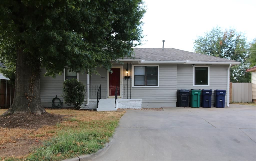 HOUSE PLUS WORKSHOP... Don't miss out on this updated home with remodeled kitchen and bathroom, new solid surface floors, new ceiling fans, 2nd living area, STORM SHELTER, and a 20 X 20 WORKSHOP.  Extra-wide driveway, mature oak tree shading the front yard; wood privacy fence and gate add to your comfort and security.