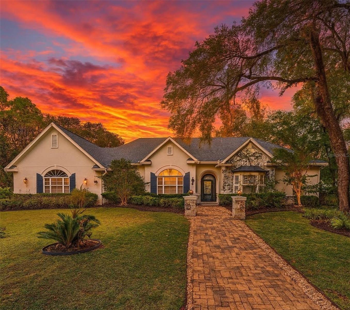 One or more photo(s) has been virtually staged. Experience an exceptional blend of luxury, craftsmanship, and estate style living in this custom built home on over an acre of beautifully manicured land. Offering nearly 3000 square feet, this residence was designed with intention and built with premium materials that set it apart from anything else on the market. Every detail reflects elevated quality from the fourteen foot ceilings to the tray accents, intricate cut outs, crown molding, and artisan finishes that define each room. ROOF 2022, AC 2023, WELL 2023The heart of the home is the expansive kitchen designed with curated details, abundant cabinetry, and a massive walk in pantry. The primary suite is a true retreat with a resort style marble bathroom featuring a fully marble bathtub, step, and shower along with a large custom closet. Additional bedrooms are spacious with high ceilings and include thoughtfully crafted built in shelving and a dedicated desk area.The enclosed back porch offers an elegant extension of the home with generous space for an outdoor kitchen, morning coffee, or evening gatherings. Mature landscaping, two electric water fountains, and a stone gas fireplace frame the property with an estate like feel. A massive laundry room, a well maintained two car garage, a young roof, young AC, and a new well complete the home with long term peace of mind.Stained glass accents add character and artistry throughout while natural light enhances the home’s warm and inviting design. Adjacent access to Lake Dorr provides opportunities for boating, fishing, and kayaking offering a rare combination of luxury living and outdoor recreation. Conveniently located within twenty minutes of grocery stores and twenty five to thirty minutes from downtown Eustis and Mount Dora for dining and entertainment.This home stands as a one of a kind offering where quality, comfort, and craftsmanship come together. It is ready to be brought to life by its next owner.