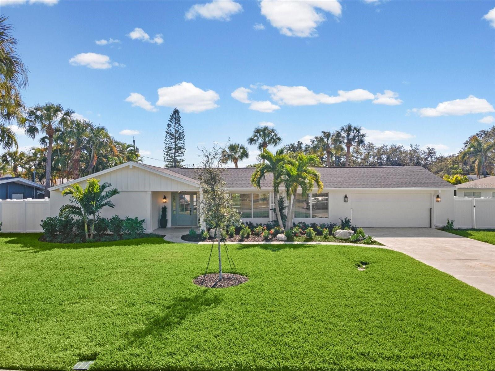 This beautifully remodeled 3-bedroom, 2-bath, 2-car garage home in Harbor Bluffs offers modern design, structural resilience, and true move-in readiness. Completely rebuilt to exceed 2025 standards, . Reimagined by a Certified General Contractor, the property features all-new electrical, plumbing, HVAC (2025 Bosch), impact windows/doors, insulation, drywall, and upgraded roof (2021). Engineered for peace of mind with a Garrison Hammerhead Flood Barrier System and 22 kW elevated Generac generator. Inside, enjoy an open, light-filled layout with a designer kitchen (quartz, custom cabinetry, stainless appliances), spa-quality bathrooms, and premium finishes throughout. Situated on a generous lot with room for a pool, this home is surrounded by multi-million-dollar properties and minutes from Belleair Bluffs, Belleair, Indian Rocks Beach, golf, parks, and dining. A rare opportunity to own a fully rebuilt, coastal-ready residence in prestigious Harbor Bluffs.
