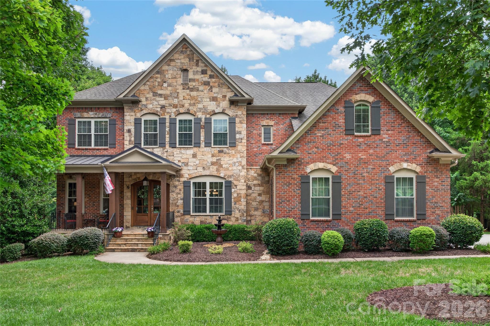 Gated... WAYBRIDGE at WEDDINGTON... Nearly 1 Acre... 5500+ Sq Ft... Multiple Bonus/Rec/Flex Spaces... Top Schools... RARE OPPORTUNITY!!! Luxury and Southern Charm Abounds in This 5 Bedroom, 6.5 Bath Brick and Stone Weddington Estate... Over 5,500+ Heated Sq Ft in Gated Community on Nearly One Acre Nestled on Quiet Cul-de-Sac... Spacious 3-Car Side Load Garage With Dedicated EV Ready - 240V Level 2 EV Charging Station! Zoned for Antioch Elem, Weddington MS & HS!  Impressive Front Porch with Custom Double Doors Welcomes Guests. Light Filled Foyer Opens to Gracious Dining Room and Entry Hall. Family Room Overlooks Beautiful Backyard with Mature Landscaping and Features Gas Fireplace Flanked by Custom Built-Ins For Display and Added Storage. Kitchen is a Cook's Delight and a Favorite Gathering Spot!  Storage Galore in Cabinetry and Walk-In Pantry... Loads of Counter Space + Oversized Island with Counter-Height Seating Makes Serving a Crowd So Easy! Large, Casual Dining Area with Custom Built-Ins and Wall of Windows... Cozy Keeping Room With Vaulted Ceiling Opens to Kitchen, Rear Deck, Stone Patio with Fire Pit and Relaxing 8-Person, Jet Artesian Spa with LED Lights, Frog Chemical System, Easy Cover and Privacy Screen. Side Porch Entry Off Driveway Leads to Half Bath and Drop Zone with Built-In Cubbies and Hooks. ALL 5 BEDROOMS HAVE EN-SUITE BATHS! Main Level Guest Suite with Full Bath Currently Used as Office. On Upper Level, the Spacious Primary Suite Enjoys Double Door Entry, Dual Walk-In Closets, Large Bath with Vaulted Ceiling, Custom Shower With Bench Seating and a Private Water Closet. Laundry Room With Storage Cabinets Is Conveniently Located on Upper Level With Washer/Dryer Included! The 5th Bedroom Opens to an Extra Bonus Room/Flex Space. ALL BEDROOMS UPSTAIRS HAVE WALK-IN CLOSETS! Large Play/Recreation Room on Upper Level PLUS Huge 3rd Floor Media/Bonus Room with a Full Bath and Walk-In Attic Storage.