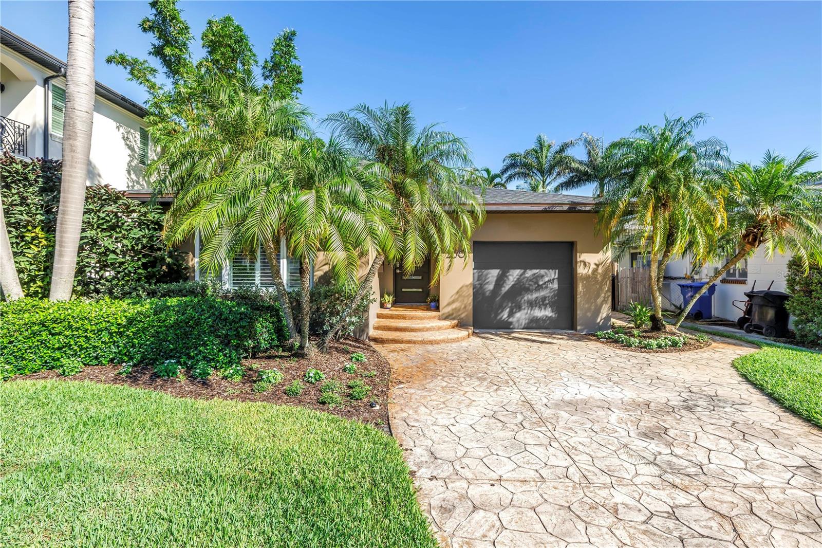 Charming, updated 2-bedroom home in prime Snell Isle location!!
Welcome to this beautifully updated 2-bedroom, 2-bath residence in the heart of highly sought-after Snell Isle, just one block from Coffee Pot Bayou and minutes from vibrant downtown St. Petersburg. Inside, you'll find a light-filled open-concept floor plan with gleaming oak hardwood floors and custom plantation shutters throughout. The spacious living area flows seamlessly into a chef-inspired kitchen fully renovated in 2020, featuring KraftMaid soft-close shaker cabinetry, granite countertops, stainless steel appliances, and recessed lighting, perfect for entertaining or everyday living. Both bedrooms offer generous space and include cedar-lined closets with custom California Closet systems. The primary suite boasts a luxurious en-suite bath with a dual-sink waterfall-edge vanity, an oversized walk-in shower, and an additional custom walk-in closet for ample storage.
A versatile office nook just off the living room is ideal for remote work or reading. French doors open to a private, shaded side porch, the perfect spot for your morning coffee or evening glass of wine. The fully fenced backyard includes a brick paver patio and space for a small spa, creating a serene outdoor retreat. Additional upgrades include a new roof (2024), tankless water heater (2019), HVAC (2018) and a 240 Volt outlet in garage for an EV. 
All this, just steps from waterfront sidewalks, three blocks to the exclusive Vinoy Golf Club, and a short stroll or bike ride to vibrant downtown St. Petersburg's dining, shopping, and waterfront parks! This is a rare opportunity to own a move-in-ready home in one of St. Petersburg’s most coveted neighborhoods. Don’t miss it!