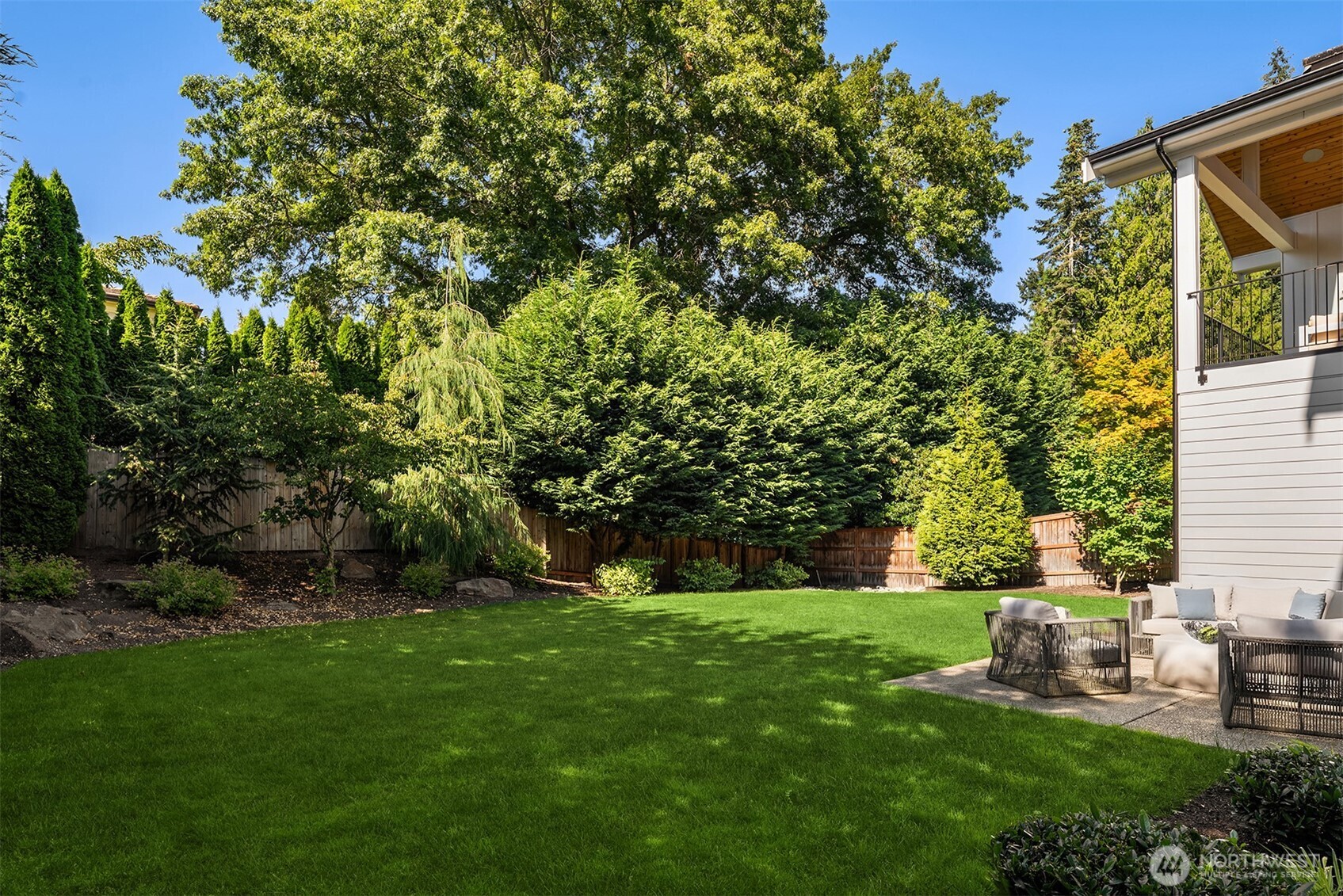 Large, level, fully fenced backyard.
