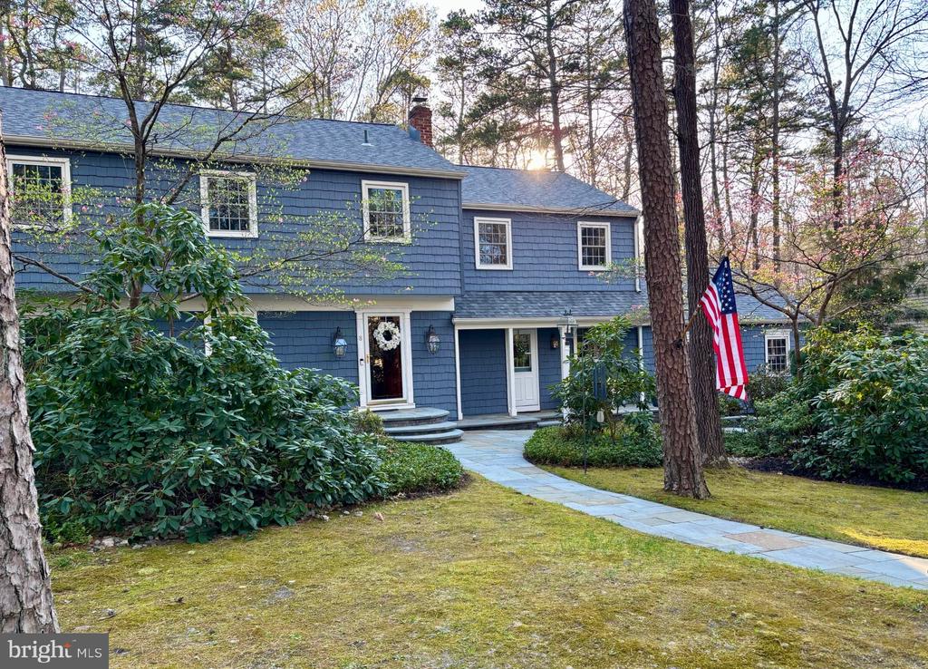 Nestled in the desirable Tall Pines subdivision, this beautifully maintained Colonial offers timeless style and serene privacy. The open floor plan features hardwood floors, crown molding, and abundant natural light. The gourmet kitchen includes a six-burner gas range, Sub-Zero refrigerator, pantry, custom cherry cabinetry, and a large center island with quartz countertops, opening to a cozy family room with brick fireplace and a massive great room with skylights, newer floor-to-ceiling windows, dry bar and serine wooded views. Formal dining room with pocket doors is perfect for entertaining and provides flexible dining options.The primary suite offers a walk-in closet and newly updated bathroom with walk-in shower. Additional extra-large bedrooms, home office, and bathrooms provide comfort and a spacious atmosphere. Outdoors, enjoy professionally landscaped grounds backing to preserved open space with mature trees, wrought-iron fencing, BBQ with gas line, lighting, and underground sprinkler system. Additional features include a side-entry two-car garage and slate paver sidewalks.Conveniently located near Philadelphia and the Jersey Shore, and situated in the highly regarded Medford school district, this home offers the perfect blend of nature, comfort, and location.