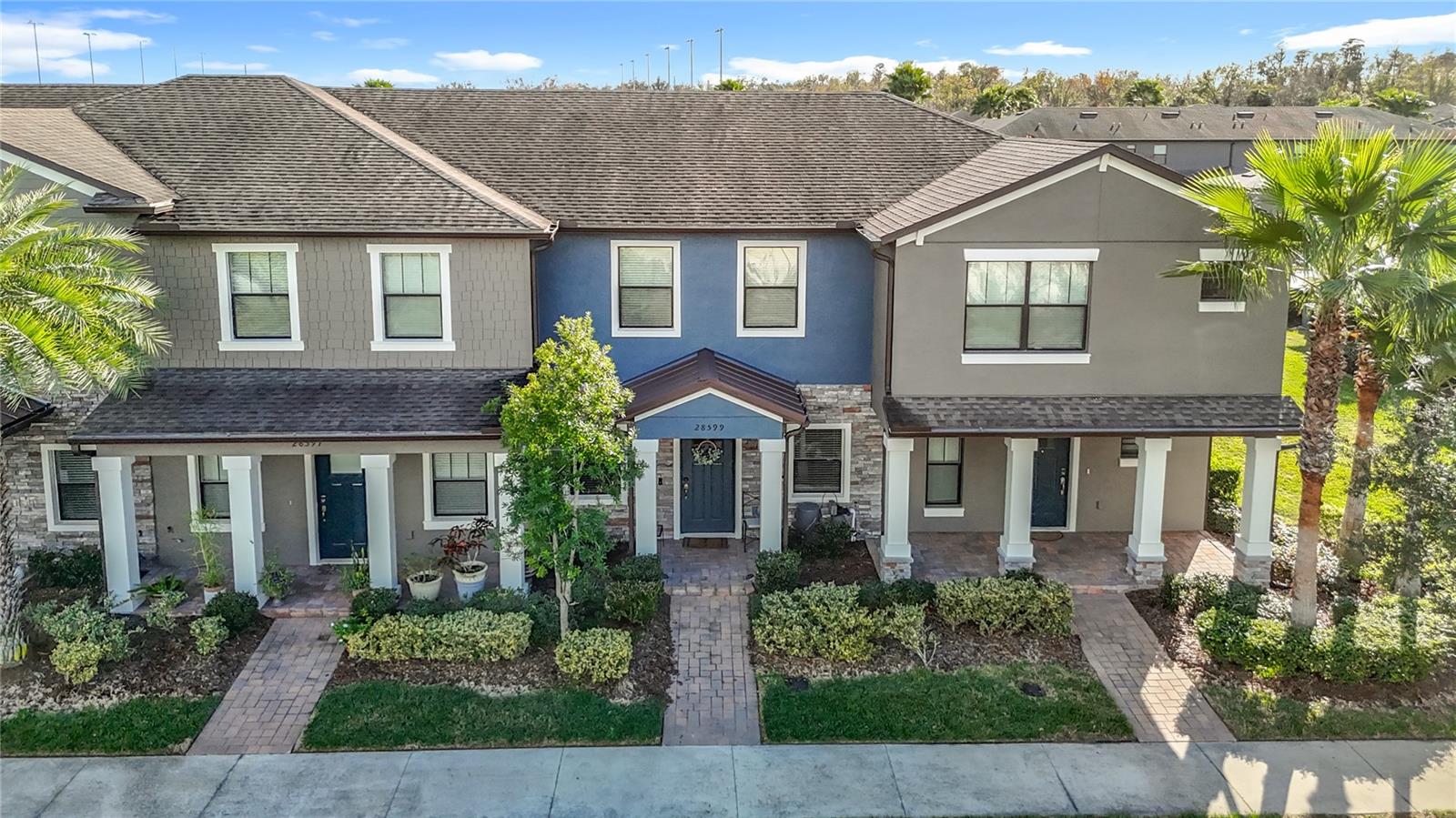 Welcome to The Arbors at Wiregrass Ranch, where affordability, low maintenance living, and an unbeatable Wesley Chapel location come together. This beautifully maintained 2-bedroom, 2.5-bath townhome offers a smart layout and modern finishes, perfect for today’s lifestyle.The first floor features a spacious open-concept design, ideal for entertaining, with a convenient half bath. The modern kitchen boasts 42-inch cherry cabinetry, granite countertops, and a breakfast bar, along with a separate laundry room located just off the kitchen for added functionality. Granite countertops continue throughout all bathrooms, adding a cohesive, upscale touch.Upstairs, you’ll find two generously sized bedrooms, each with walk-in closets and private en-suite bathrooms, providing comfort and privacy for everyone. Step outside to the screened-in rear porch, a perfect spot to relax or entertain, which conveniently connects to the one-car detached, rear-facing garage. The garage offers easy access via a private rear alleyway, keeping the front of the home charming and uncluttered.The HOA includes lawn care, exterior maintenance, and access to the community pool, making this an ideal low-maintenance option. Community amenities also feature walking trails, a dog park, and a community park.Located just 1.6 miles from the state-of-the-art hospital and minutes from shopping malls, restaurants, and top-rated schools, this home delivers both convenience and value in one of Wesley Chapel’s most desirable communities.An excellent opportunity for homeowners or investors alike—schedule your showing today!