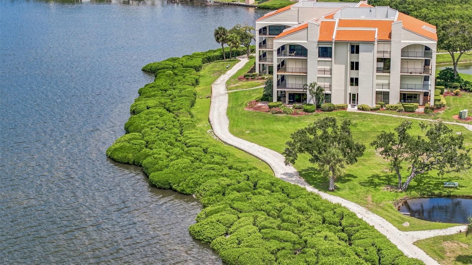 Welcome to Tarpon Cove, a gated waterfront community offering the perfect blend of low maintenance living, resort style amenities and an unbeatable Tarpon Springs location. Overlooking the community’s private marina, this meticulously renovated 2 bedroom, 2 bathroom condo offers nearly 1,100 square feet of beautifully updated interior living space. Freshly painted with new luxury vinyl plank flooring throughout, every detail has been thoughtfully selected with no expense spared. The newly remodeled kitchen features granite countertops, abundant cabinetry and pantry storage, black-finished hardware and faucet, a wine refrigerator and a reverse osmosis system. The kitchen flows effortlessly into the dining and living areas, creating an inviting space for everyday living and entertaining. Both bathrooms have been fully renovated with new flooring, vanities, showers and modern tilework. Just beyond the main living area, the Florida room provides a peaceful place to enjoy your morning coffee or unwind at the end of the day while watching the boats and wildlife along the marina. Tarpon Cove delivers the waterfront Florida lifestyle without the upkeep. The community is protected by a 24-hour guard and features a private marina with boat slips available to rent on a first-come, first-served basis. Residents also enjoy kayak storage, two heated pools, a clubhouse, fitness center, jacuzzi, tennis and pickleball courts, a fishing dock, waterfront walking trail and a community grilling area complete with a grill and smoker. Enjoy the convenience of an on-site EV charging station located outside the pool gate near the clubhouse. The quarterly HOA fee includes cable, internet, water, sewer, trash, pool maintenance, exterior maintenance, groundskeeping, exterior pest control, property management, escrow reserves, common area taxes, 24-hour guard service and private roads. Boat slips are available for an additional $375 per quarter and include water and electricity. With a three month minimum rental period, this property also offers flexibility for seasonal use. Located just minutes from the famous Tarpon Springs Sponge Docks, Three Rooker Island, the world class Innisbrook Golf Resort, the Pinellas Trail and some of the area’s most beautiful beaches, including Sunset Beach, Fred Howard Park and Honeymoon Island. Shopping, dining and everyday conveniences are nearby, with Tampa International Airport approximately 45 minutes away. This is your opportunity to enjoy private marina views, exceptional amenities and the very best of Florida’s waterfront lifestyle. Schedule your showing today!