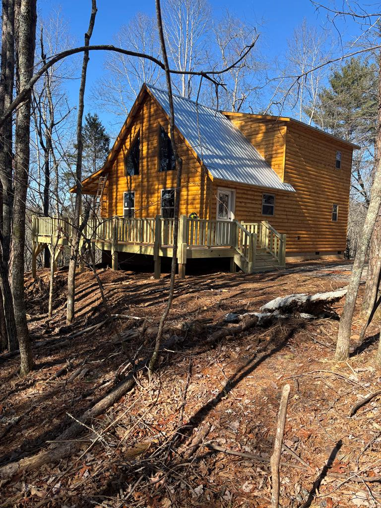 Public Remarks: Murphy NC - Brand New Home - Under Construction - Fiber Optic Internet - Underground Utilities - Located in a Wooded Setting in Brand New " BRASSTOWN COUNTRY ESTATES " This home is a 2Bed/2Bath 24x36 Mountain Chalet Style Mountain Home. Plenty of Room for Large Garage, The Home Includes a Durable Metal Roof, Log Sided, Full Covered Back Porch, A Front Covered Entry Porch. The interior of the home is All Wood Tongue & Groove Interior, Oak Flooring throughout, Granite Counter Tops from our Local Murphy Granite Shop, The Custom Pine Cabinetry is built from one of our Local Cabinet Makers. When you enter the home, you will step inside an Open Great Room with Tall Cathedral Ceilings and Beams in the Ceiling for that rustic charm, Lots of Windows for natural ambient lighting, The great room has a Stack Stone Gas Log Fireplace with Gas Logs for cool evenings & ambiance. This property is Approx 8+/- Miles to Downtown Murphy NC with Easy Access to Shopping, Restaurants & Medical Facilities. Want Evening Entertainment? Your only a few miles to the Local Henn Theater & Harrah's Casino. Murphy NC has something for Everyone. There is a large TVA Lake Hiawassee for Fishing & Boating, And, for all you Outdoor Enthusiast Cherokee County has 92,000+ Acres of US Forest Service with scenic views. There is also 2 locations for White Water Rafting (The Ocoee & The Nantahala). And There is more. I Can't Wait to show you this Beautiful Brand New Home in Murphy NC. So, if you are tired of the Hustle & Bustle of City Life and Ready to experience how wonderful it is to Live The Mountain Life! Give Me a Call, This Custom Home is Built by a NC Licensed Contractor & meets the NC Building Codes & comes with a Certificate of Occupancy from the Cherokee County Building Department. The Contract will include $1400. for Buyer at closing for Appliance Allowance, and $650. to Buyer for Lighting Allowance. Photos are sample photos & will be updated ad Builder progresses with new construc