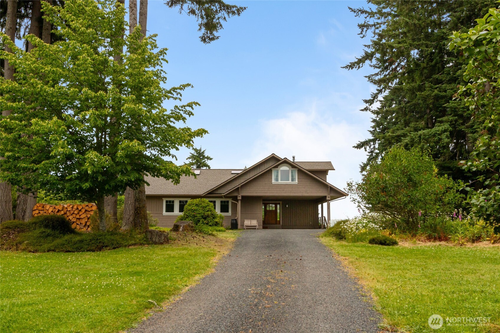 Amazing 5-bedroom 4000+ sq ft home w/ a main floor primary suite. Rock gas fireplace in the living room and rich hardwood floors throughout. The updated chef’s kitchen features a professional-grade range and cherry cabinetry - it was designed when the home was renovated to the studs in the early 2000s. The daylight basement w/ a wood fireplace offers flexible space—maybe a second independent living area. It also has a bomb shelter / cold room. Private office & den on upper level. Outdoors has raised garden beds w/ a water catchment system, chicken coop, fruit trees, garden shed, & pasture area. Mature landscaping, plus 50-amp RV hook-up with space for future shop. A rare blend of comfort and rural charm all with stunning territorial views.