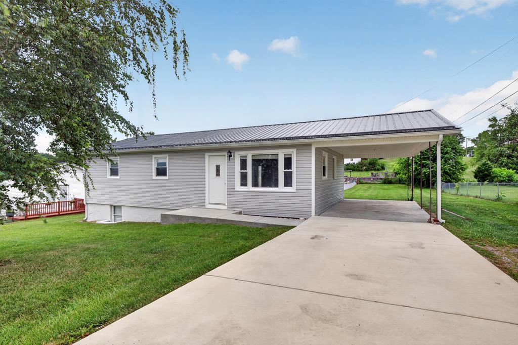 New Price! Welcome to 405 Holston Heights Drive, a well-maintained single-level ranch offering comfort, convenience, and plenty of potential. This move-in ready home features easy one-level living along with a full unfinished basement, providing abundant storage space or the opportunity to expand to fit your needs. Outside, you'll find a level backyard perfect for pets, gardening, or entertaining. Conveniently located near local schools and the Little League baseball fields, this property offers a great setting for families while still providing the peaceful feel of a residential neighborhood. Whether you're a first-time homebuyer, looking to downsize, or searching for an affordable investment, this home checks a lot of boxes.