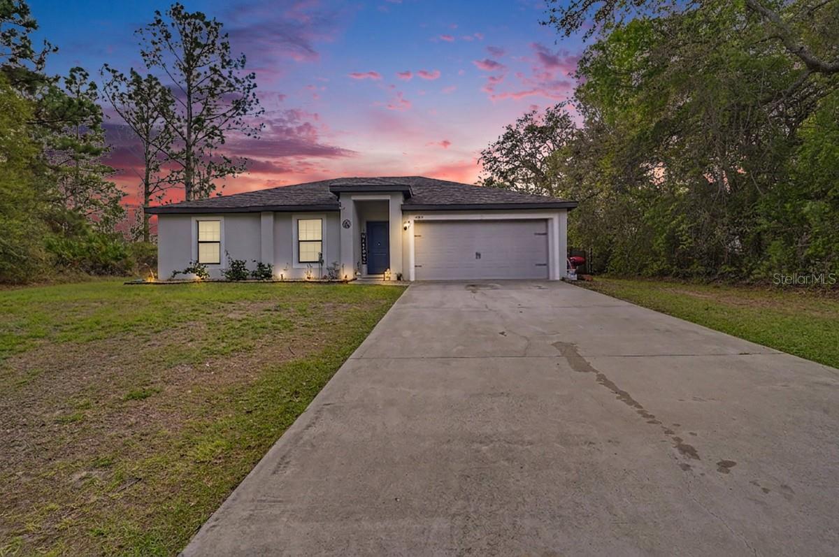 Deltona Lakes! This move-in ready, 2019 built home features 3 beds, 2 baths, 1,270 sqft, and a 2-car garage on a 0.23-acre fully fenced lot. Built on a solid slab with shingle roof and central AC — all just 5 years old — giving you new construction peace of mind without the price tag. Inside enjoy tile and carpet flooring, dark cabinetry, granite countertops, stainless appliances, split bedroom layout, walk-in closets, and an open living area perfect for entertaining. Backyard includes a storage shed and plenty of privacy. No HOA headaches — just a solid, well-built home ready for its next owner. Priced to move fast — schedule your showing today!