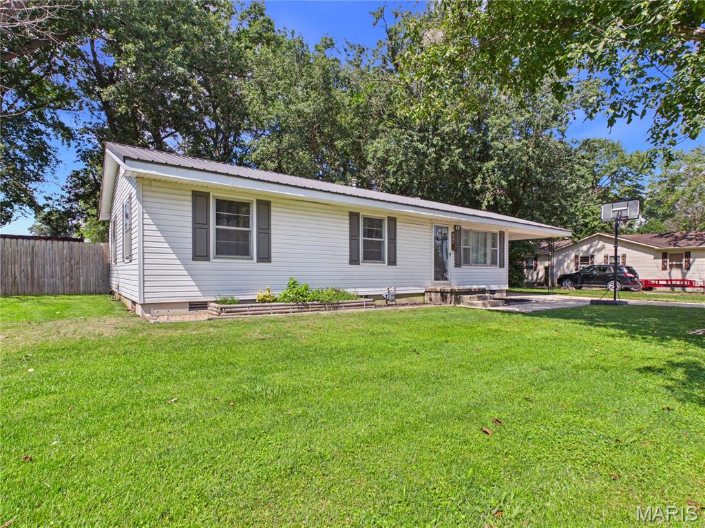 Small town living just hits different. A quiet street, a park nearby, and a place where life moves at a pace that lets you actually enjoy it. This newly listed 3 bedroom, 1 bathroom home offers a fenced in back yard, a spacious deck for relaxing after a long day, and a large shed with plenty of room for storage, hobbies, or weekend projects. If you've been looking for a little less noise, this one might be exactly what you've been waiting for! Call me for more details or to schedule a private showing.