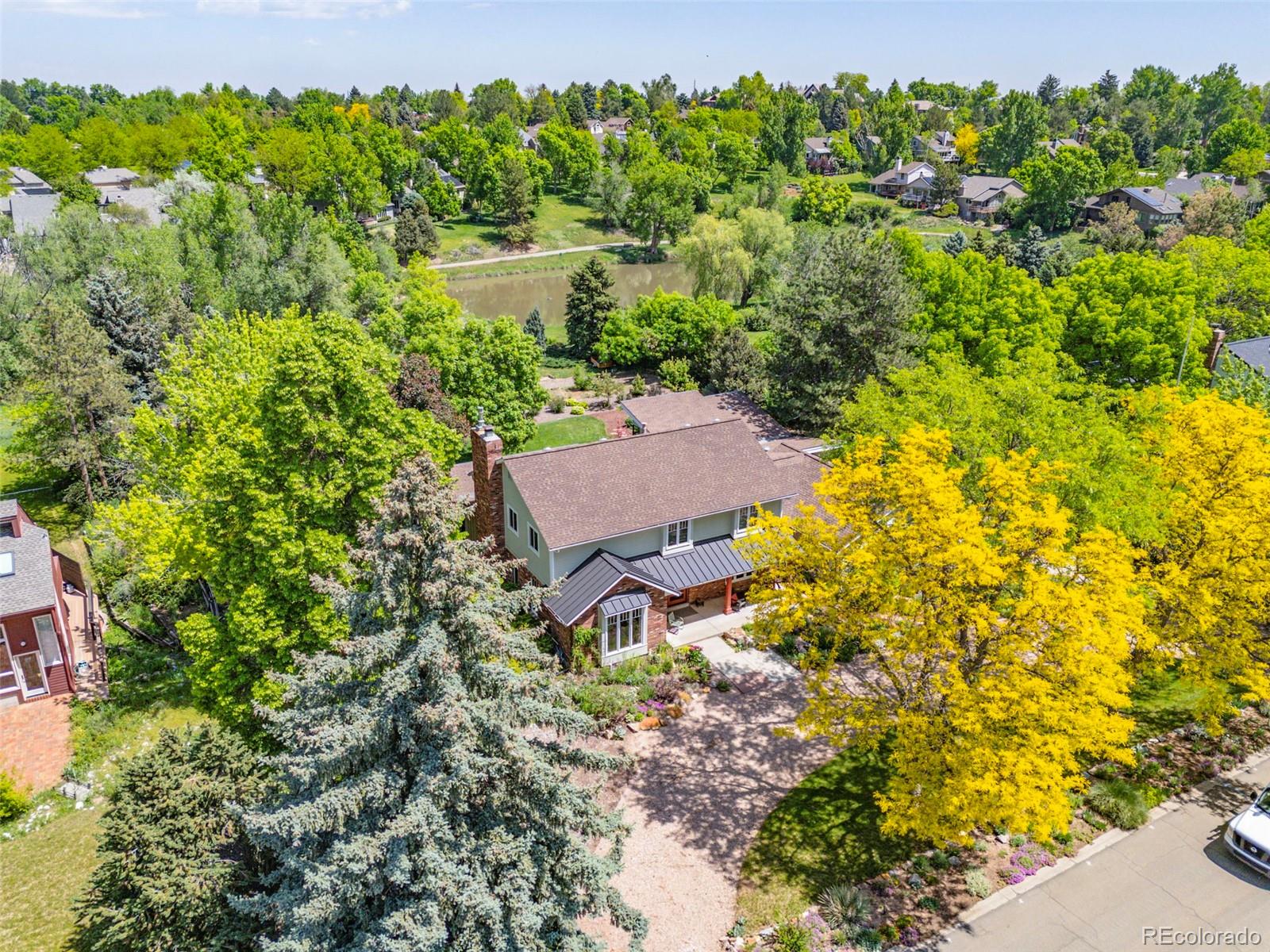 Hands down, this is the most amazing home you will ever tour. Located on almost an acre in Old Towne Littleton this home boasts over 5,000sqft and sits on a quiet cul-de-sac. With over $1,000,000 spent on an addition and improvements in 2020 this main floor living house is truly enchanting. The main floor Primary Bedroom has soaring ceilings and a thoughtfully designed layout. The Primary Suite even has an adjoining office, art studio or living room so you are never far from what you need. The world class kitchen boasts Wolf appliances and has a remarkable view of the parklike backyard. The open flow with custom built touches throughout will lead from the front door to the sprawling, beautifully landscaped backyard. As you sit on the massive deck you can enjoy the numerous mature trees and the views of Ashbaugh Pond. Tired of just sitting around relaxing? Walk through your yard to Lee Gulch Trail and head to Downtown Littleton for dinner and the theater. With the original Primary Suite upstairs, as well as 3 other upstairs bedrooms, this home will provide all the luxury you want without any compromises.
Information provided herein is from sources deemed reliable but not guaranteed and is provided without the intention that any buyer rely upon it. Listing Broker takes no responsibility for its accuracy and all information must be independently verified by buyers.