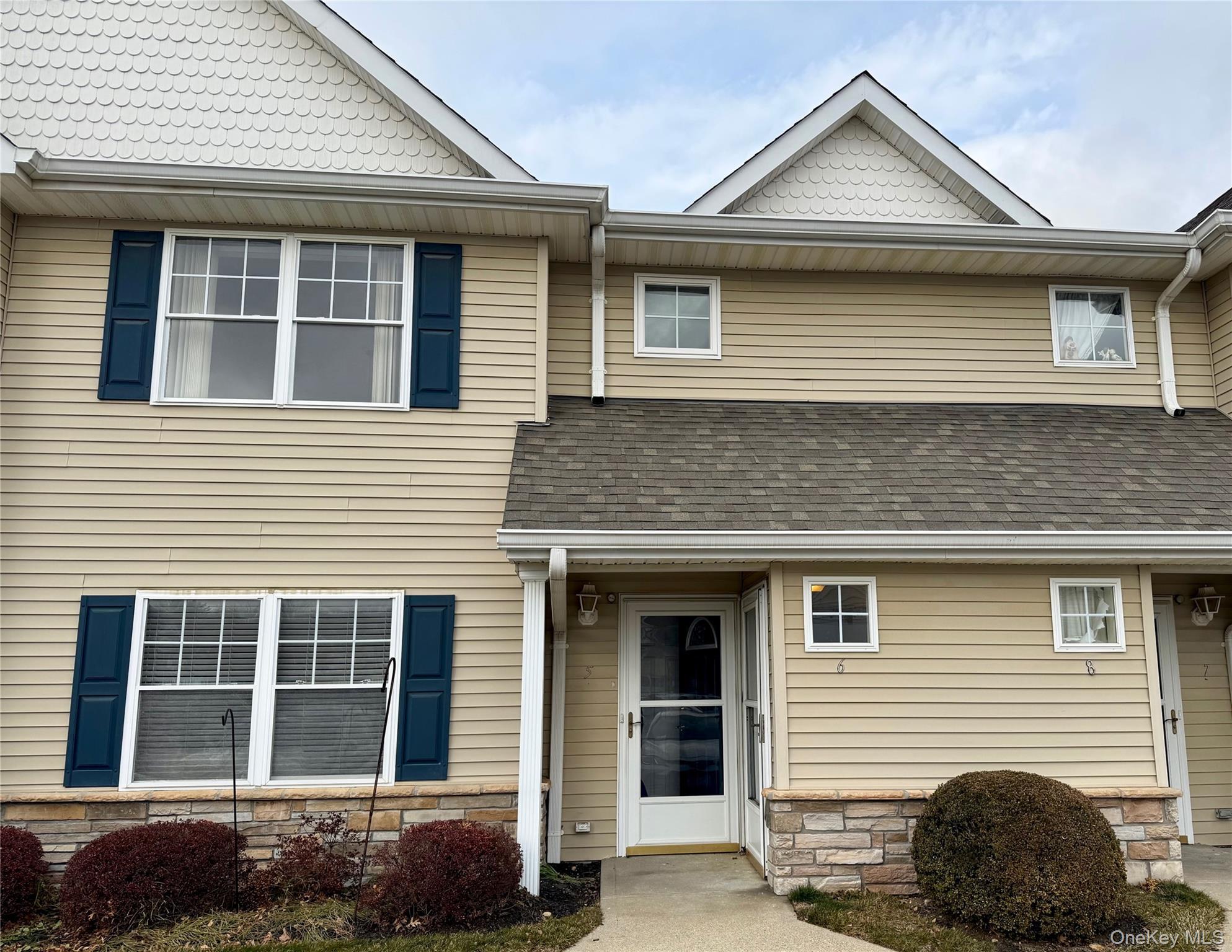 Enjoy carefree living in this active 62+ gated community with exceptionally low taxes. This bright and spacious condo features a combined living and dining area with soaring vaulted ceilings, creating an open and airy feel. The king-size primary bedroom includes a full en-suite bath, while the second bedroom—ideal as a den or guest space—adds flexibility. The kitchen offers gas cooking, a center island, pantry, and ample storage. Additional highlights include in-unit washer and dryer, private deck off second bedroom, gas heat, and central air conditioning.Residents enjoy outstanding community amenities such as a clubhouse, in-ground pool, card room, social hall, and exercise room. Move right in and start enjoying the lifestyle.