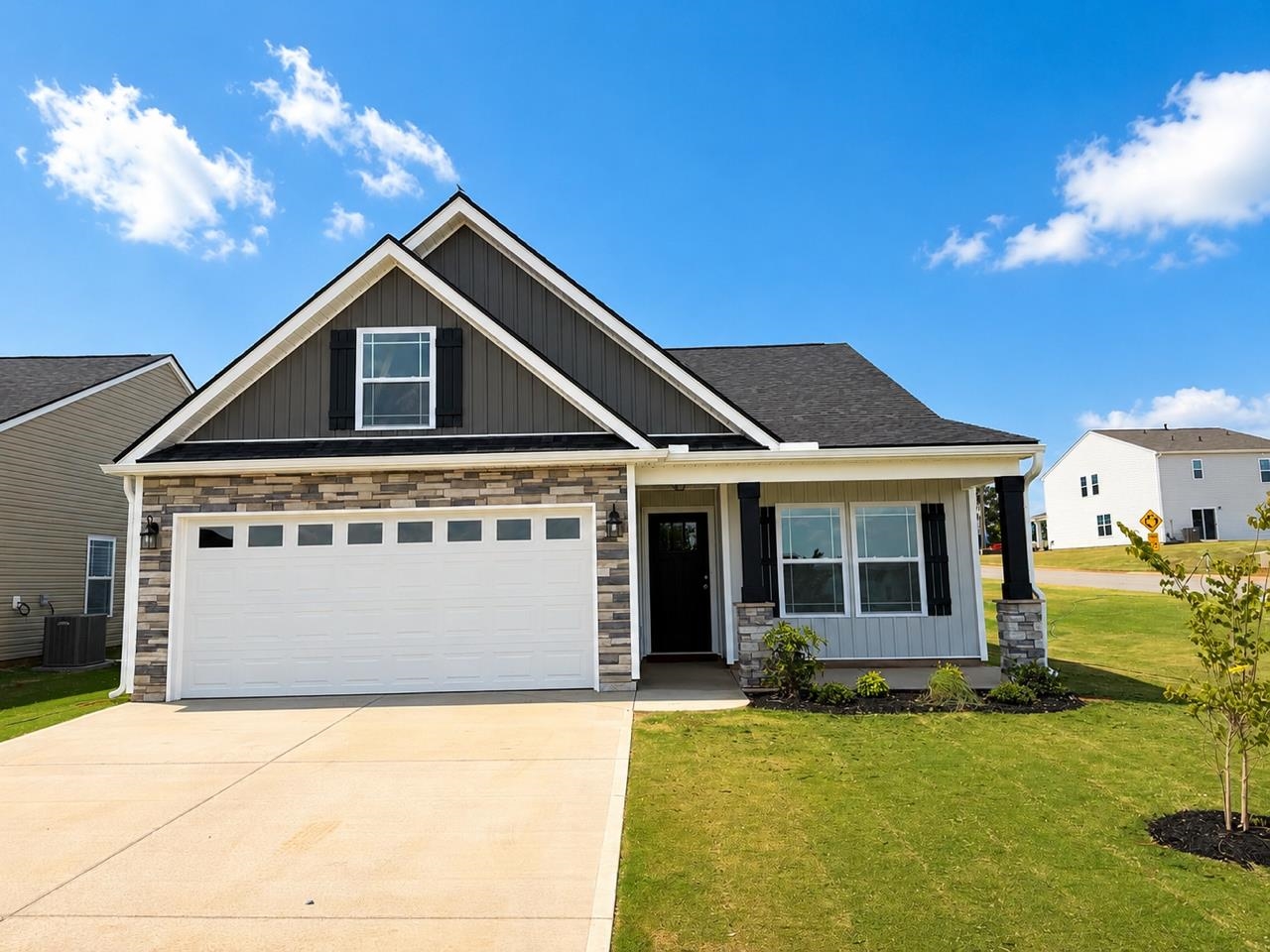 The BISHOP plan (Lot 83) has a spacious open living area and study. Master bath double vanity and garden tub in addition to the walk-in shower. Granite countertops, fireplace, crown molding with rope lighting, and many more features included. 12' X 12' sunroom overlooks a 10'x12' patio on a corner lot.  30-year architectural shingles, site-built construction, and a 10 year limited warranty are included to give you peace of mind.   *Virtual tour reflects same house plan, not exact house.