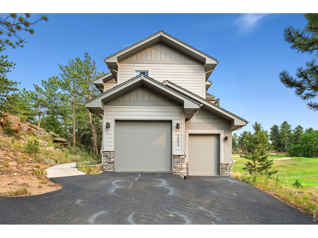Welcome to this stunning mountain retreat nestled on the 17th fairway of the prestigious Fox Acres Country Club-one of Colorado's premier mountain golf course communities. Located in the heart of scenic Red Feather Lakes, this beautifully upgraded 2-story home offers 2,110 square feet of refined living space in a secure, gated community surrounded by 460 acres of breathtaking natural beauty. Step inside to find soaring ceilings and floor-to-ceiling windows in the main living room, showcasing panoramic views of the golf course, Lake Arapahoe, and the majestic Bald Mountains. A cozy gas fireplace and gleaming wood floors add warmth and elegance to the space. The chef's kitchen features high-end appliances, custom cabinetry, and a walk-in pantry, with a dedicated dining room perfectly positioned between the kitchen and living area. Just outside, a covered porch leads to a spacious composite deck-ideal for relaxing or entertaining with unbeatable mountain views. Upstairs, you'll find two spacious bedrooms, each with en-suite bathrooms, generous closets, and private balconies to soak in the fresh mountain air. Additional features include a 2-car garage, premium finishes throughout, and access to top-tier amenities. Fox Acres offers members exclusive opportunities for golf, private fishing, and a wide range of outdoor adventures. The community provides paved roads, secure gated entry, doorstep snow removal, and its own private water and sewer treatment facility for year-round convenience. This is more than a home-it's a lifestyle. Discover the serene luxury of Fox Acres living today.