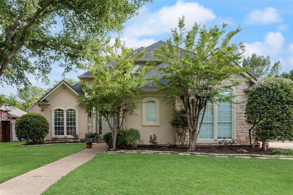 Nestled in a beautiful section of Trophy Club with direct access to Grapevine Lake trailheads, this fully renovated 4-bedroom, 3.5-bath home offers the perfect blend of luxury, comfort & location. A grand curved staircase makes a stunning first impression, while nailed-down light oak hardwood floors and elevated finishes set the tone throughout the main level. Designed for both everyday living & entertaining, the front sitting room flows seamlessly into the formal dining space, while a dedicated office with built-in desk & cabinetry provides the ideal work-from-home setup. The chef’s kitchen is a true showpiece, featuring freshly painted white cabinetry, quartz counters, marble backsplash, breakfast bar, pull-out trash & recycle bin & top-of-the-line Bosch SS appliances. The spacious family room impresses with a dramatic floor-to-ceiling gas fireplace, custom built-ins & a stylish dry bar. with wine rack. Retreat to the serene primary suite with a cozy sitting area & a beautifully remodeled spa-like ensuite complete with dual vanities, freestanding tub, oversized shower with bench seat & frameless glass, porcelain tile flooring & spacious walk-in closet. Upstairs, enjoy a large game room, 3 generously sized bedrooms- 2 with walk-in closets—& 2 full baths. The oversized laundry room offers a sink, abundant storage & space for a refrigerator (laundry fridge conveys)! Step outside to your private backyard oasis, where a covered patio overlooks a sparkling pool surrounded by mature shade trees—perfect for relaxing or entertaining. Extensive 2025 updates provide peace of mind, including a new Class 3 hail-resistant roof (Dec 2025), new downstairs HVAC system with transferable lifetime warranty (April 2025), fresh interior paint, new LED can lighting, updated flooring & modern fixtures throughout. Ideally located near Trophy Club Country Club & golf course, & just minutes from Westlake’s financial district & Southlake Town Square, this move-in ready home truly has it all!