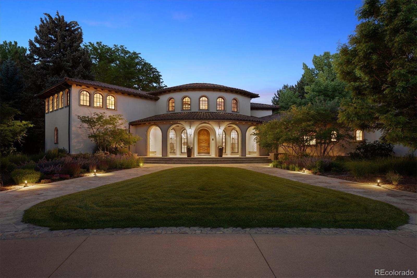 This spectacular home has never before been on the market and is truly something very special. Welcome to 12 Lynn Road – A Spanish Revival inspired home designed by renowned architect, Don Ruggles and interior designer, Mikhail Dantes. Located in Cherry Hills Village - Colorado’s most coveted community with close proximity to the city as well as Cherry Hills Country Club - the most exclusive country club in the western United States. Combining luxury and privacy – your own private paradise! An extraordinary property on over 4 acres and graced with an abundance of towering, mature, 100-year old trees, flower gardens, generous garden boxes, a fruit orchard and thriving vineyard – Tuscany in the heart of the Rocky Mountains. This stunning property has hosted multiple weddings, family gatherings as well as visiting dignitaries from around the world. Gorgeous and serene entertaining spaces throughout including the north courtyard and the living area that opens to the loggia and yard/vineyard for a seamless transition from inside to outside. The architectural grandeur is unmistakable – from the breathtaking groin vaulted great room designed for impressive entertaining to the dramatic two-story library that invites quiet reflection.  An indulgent primary suite is a private sanctuary with private access via spiral staircase to the lower level exercise room.  A theater room, game room, card/poker room and lounge plus an extraordinary wine cellar and tasting room ensure endless opportunities for enjoyment and relaxation.  Don't miss the 200 ft tunnel to the bunk room (bedroom 7).This home is truly a sanctuary with old world charm blended with modern conveniences to make this an exceptional, one of a kind, world class masterpiece. Only minutes to the Denver Tech Center, Cherry Creek  and downtown Denver, the location of this home is superb. A rare opportunity to own a legacy estate that’s as inviting as it is iconic.