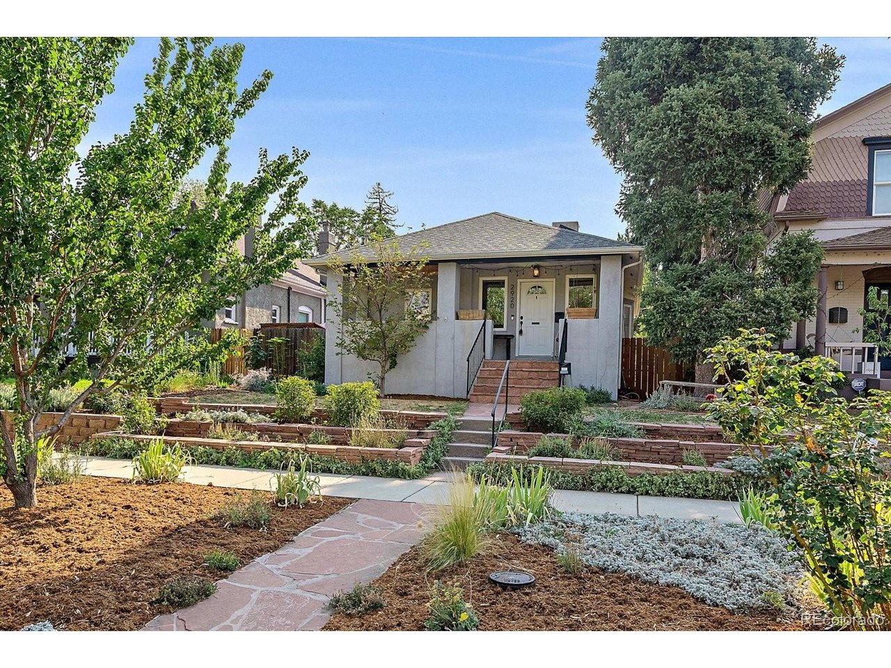 Charming Whittier Bungalow with Rare Carriage House!Welcome to this beautifully updated Whittier gem, perfectly blending historic character with modern functionality. The inviting front porch overlooks a tiered front garden. Step inside you will be welcomed into a light-filled main level with gleaming hardwood floors and an open-concept living and dining layout. The renovated kitchen boasts solid-surface countertops, tile backsplash, upgraded cabinetry, and stainless steel appliances. Two comfortable main-floor bedrooms and a full bath complete the upper level.The fully finished lower level adds versatile living space, featuring a cozy family room area, laundry, an updated 3/4 bath, and a conforming 3rd bedroom.Out back, the 480 sq ft studio carriage house is a rare find! Complete with its own address, separate Xcel electric meter, kitchen with gas stove, 3/4 bath, off-street parking, and dedicated outdoor space-ideal for multi-generational living or a potential income stream.Enjoy the fully fenced yard with raised garden beds, storage shed, and patio.  Minutes from RiNo, City Park, and Downtown Denver-a turnkey home with built-in financial flexibility!