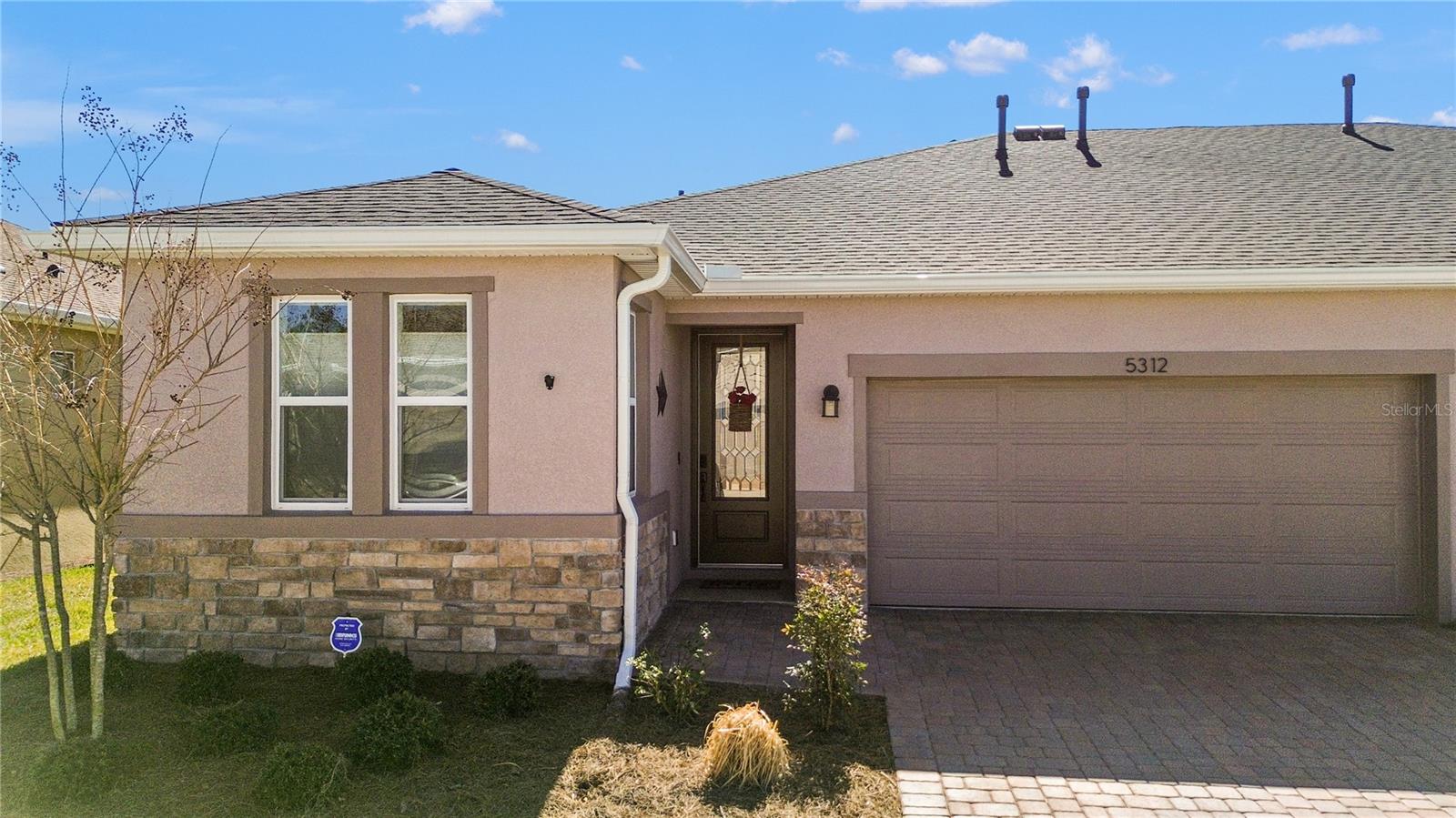 -PREMIUM LOT FOUND HERE!- Enjoy the Florida lifestyle in your like-new Shea Homes Aria model boasting $8,000 of additional upgrades in pristine 55+ Ocala Preserve. With NO CDD, the fenced, private backyard truly sets this property apart from the rest! Step inside your 2024 build, a 2 bedroom/ 2 full bathroom, 1,320 square foot villa, onto 18x18 ceramic tile, natural light pouring in through the custom glass front door. The combination of high ceilings, a neutral color palette, and trim add an airy and sophisticated feel. To your immediate left is a guest bedroom which flows nicely into the first full bathroom with tub/ shower combo. The den/office space is a lovely spot to set up your daybed or workspace, and is home to the stackable, front loading Whirlpool gas washer and dryer set which conveys! The kitchen is the heart of your home boasting upgrades galore including a GAS stainless steel appliance package, and tile backsplash. The Zanzibar granite counters and maple wood cabinets with soft-close and pull-out drawers were thoughtfully paired together; and, the 6 ft.x3.5 ft. kitchen island is an entertainer’s delight! We love the open-concept, modern functionality- kitchen, dining and living room access all at once. The living room features custom window treatments, a prewired wall mount for your television, and plenty of space for a cozy sofa and coffee table. A split floor plan, the primary bedroom with ensuite bathroom is just off of the living area. With backyard views, the primary bedroom suite sits on soft, new carpet, and can easily fit a King-sized bed; and enjoy a walk-in closet with white custom cabinetry to house your wardrobe. The well-designed ensuite bath boasts a step-in shower with tile, glass entry, dual sinks and granite, and ample storage in the maple cabinetry. Back through the main living area, the sliding glass door leads to the screened lanai, pre-fan wiring, and gas hookup for the fire pit or BBQ already in place. The backyard with black aluminum fencing and gates offers privacy and space for your pets and loved-ones; find even MORE GREEN SPACE, land that won't be built on, directly behind your lot. MORE UPGRADES TO SHARE include a sealed driveway, dedicated 20 amp 120 volt golf cart garage charging station, and plumbing for a water softening system. Ocala Preserve is a golf-cart friendly active community offering homes in both 55+ and non-age restricted ares. ‘Florida living at its best,’ enjoy indoor and outdoor dining at the Salted Brick restaurant after 18 holes of golf on the Tom Lehman-designed course, which is open to the public. Your days should include fishing and socializing at the lovely lake, dipping in the hot tub or bright blue swimming pools, exercising in the resort-style lap pool, and staying in shape at the fitness center followed by relaxation in the full service spa. Racquetball, pickleball, and tennis courts, and nearly 20 miles of walking trails for your daily adventures found here too. The HOA covers lawn care, exterior paint and power washing, roof, irrigation, and your recreational activities. Easy travel to I-75 and just minutes from Ocala’s beautiful Springs, medical facilities, dining, business opportunities, and the exciting World Equestrian Center (WEC). This is the lifestyle that you’ve worked so hard for- that you’ve dreamt about- so make it yours today!