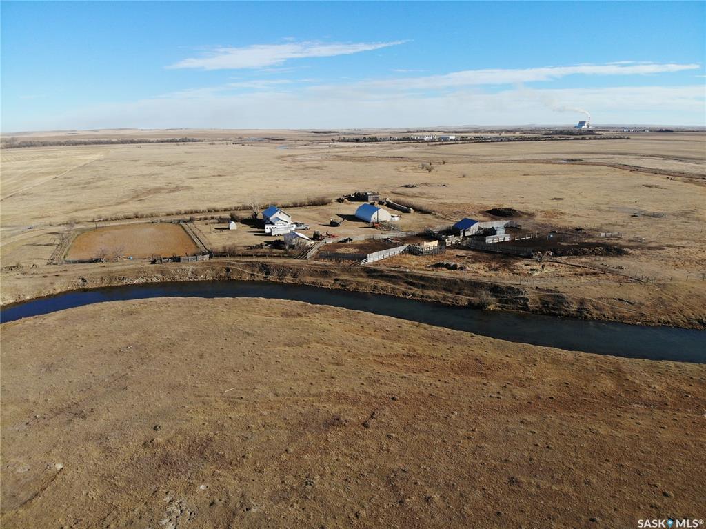 This property comprises a quarter section located in the Rural Municipality of Hart Butte just minutes from the Town of Coronach. Girard Creek runs through the land, providing a reliable and abundant water source for the ranch at all times. Natural gas is available on the property.

Residential Buildings
The main residence is a 4 bed/2 bath house featuring a one-car attached garage. Currently, this attached garage serves as a porch and utility room. The house is wired to accommodate a backup generator, ensuring continued operations during power outages.

Outbuildings and Infrastructure
• The Horse barn is constructed with a concrete floor and is fully serviced with both power and water.
• A large Quonset building measuring 40 by 60 feet offers ample space for equipment storage or other needs.
• The property features corrals and three watering bowls to support livestock operations. 
• A separate, one-car detached garage is equipped with electrical power, providing additional storage or workspace.
• Outdoor Riding Area in main yard that allows for roping, barrel racing etc. 

Land and Fencing
The entire quarter section is cross-fenced, allowing for effective management and rotation of livestock. Of the total acreage, 50 acres are cultivated, while the remaining 101 acres consist of native grass, supporting both grazing and crop production.