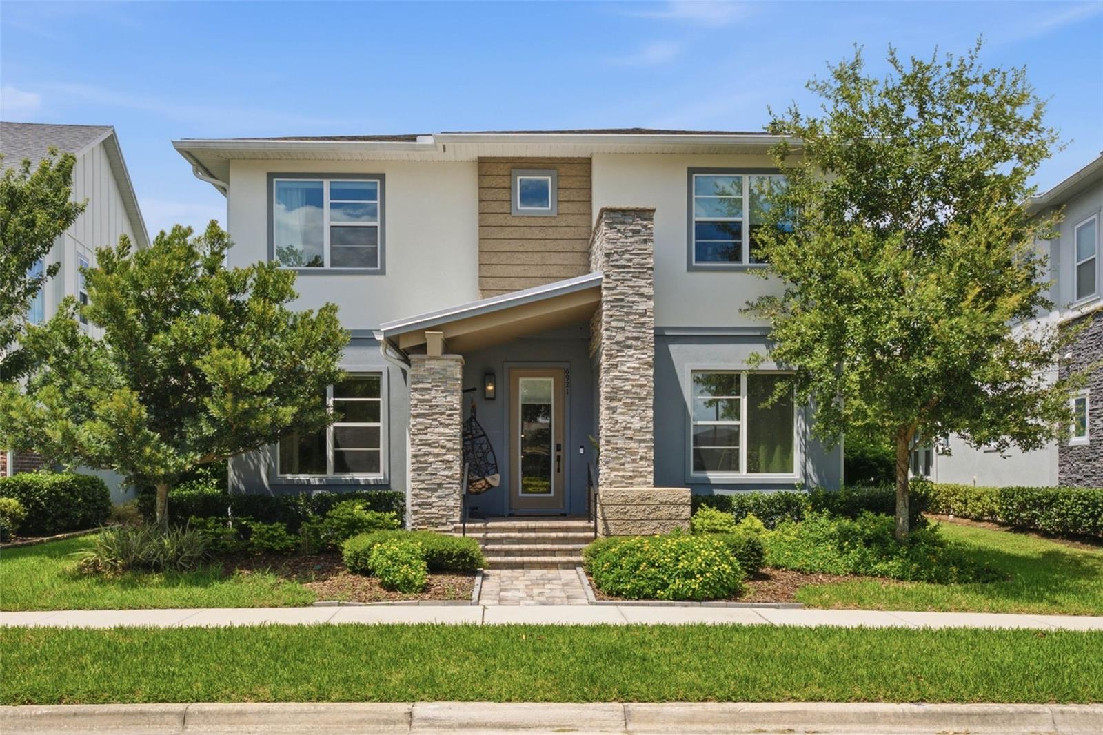 Welcome to Laureate Park—one of Orlando’s premier communities. This impressive property features a total of 6 bedrooms and 4 full bathrooms, including a spacious 5-bedroom, 3-bathroom main residence and a private 1-bedroom, 1-bathroom apartment above the 3-car garage. The apartment offers approximately 808 square feet, a private entrance, and is fully furnished. It is currently rented for $2,050/month on a month-to-month lease, providing immediate rental income and excellent flexibility for the new owner. Should the new owner wish to occupy the apartment or use it for another purpose, the tenant may be asked to vacate with 15 days’ notice, according to the current month-to-month rental arrangement. The main residence offers approximately 3,111 square feet of thoughtfully designed living space. The first floor features 2 bedrooms and 1 full bathroom. Upstairs, you'll find 3 bedrooms, including the spacious primary suite, an oversized loft, a laundry room, and an additional full bathroom.The primary en-suite features a freestanding soaking tub, a frameless glass shower, and two walk-in closets. Beautiful wood flooring extends throughout most of the main living areas, while premium upgrades include a gourmet kitchen with quartz countertops, upgraded cabinetry and appliances, a floor-to-ceiling tile backsplash, custom built-ins, sliding glass pocket doors, and designer finishes throughout.The outdoor living space is equally impressive, featuring a covered lanai with a built-in summer kitchen, perfect for entertaining and enjoying Florida’s beautiful weather. The property also offers a pleasant yard with plenty of space for little ones to play and for the family to enjoy time outdoors.Located directly across from a beautiful open green park, the home offers a wonderful setting for families to enjoy outdoor activities, play, and quality time together. The open courtyard at Merit Park is just steps away, while Amanda Linear Park and the Laureate Park Nature Trailhead are also within easy walking distance. Both the main home and the apartment are powered by a leased 35-panel whole-home solar system, installed in January 2024, helping reduce energy costs and improve overall efficiency. The home is zoned for A-rated Orange County Public Schools. Residents of Laureate Park enjoy an exceptional collection of amenities, including multiple playgrounds, resort-style pools, a fitness center, walking trails, a community garden, and more. Within a 10-minute commute, you’ll have easy access to Lake Nona Town Center, Orlando International Airport, and the University of Central Florida’s College of Medicine. Enjoy local favorites such as Foxtail Coffee, Canvas Restaurant & Market, Boxi Park, Chroma Modern Bar & Kitchen, and more. Nearby medical facilities include UCF Lake Nona Hospital (HCA), Nemours Hospital, Ronald McDonald House, the Orlando VA Medical Center—the nation’s largest VA medical center—and the brand-new AdventHealth Lake Nona ER, projected for completion in Fall 2026.To top it all off, you’ll be just a short drive from Orlando’s world-famous attractions—approximately 20 minutes to Walt Disney World, 25 minutes to Universal Studios, and 25 minutes to Downtown Orlando.Contact us today to schedule your