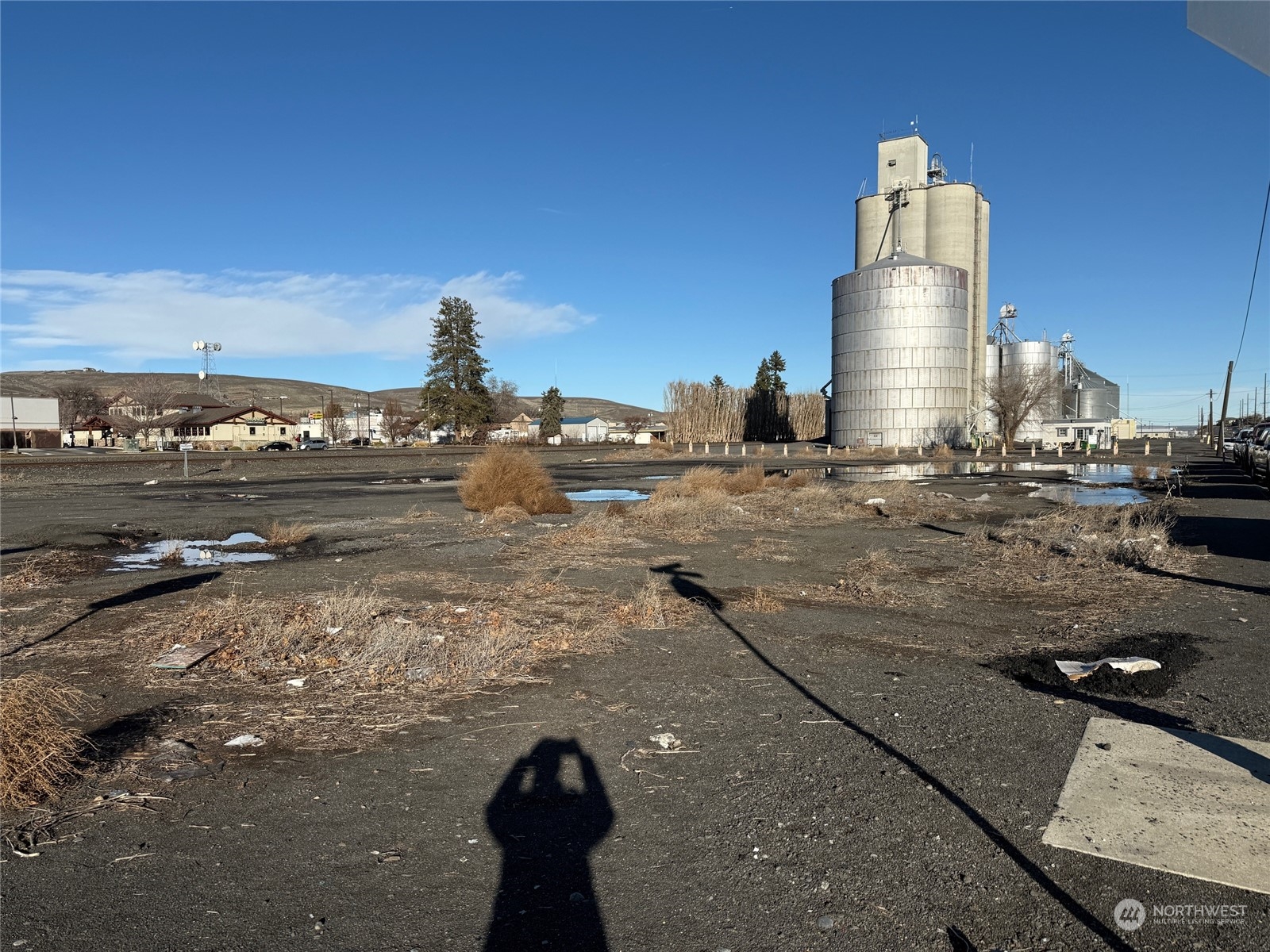 Level, corner lot on Nat Washington Way and A St SE. Almost 1 acre, zoned Industrial 1 that is NOT in the flood zone.  Busy street with lots of exposure.  160 foot of Frontage on Nat Washington Way with 258.34 feet on A St SE.  Access is from A St SE. Site is former fuel bulk plant removed in the early 1960's. Seller will allow contingency for soil testing if required, at Buyers expense. Survey done in 2003.