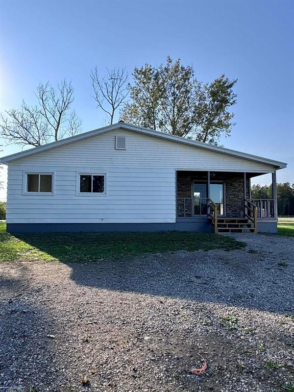 Beautifully updated 3-bedroom home offering two garages and a spacious barn. Bedrooms feature cozy carpeting, complemented by new flooring throughout the main living areas. Room sizes are estimated. Property is  agent owned.