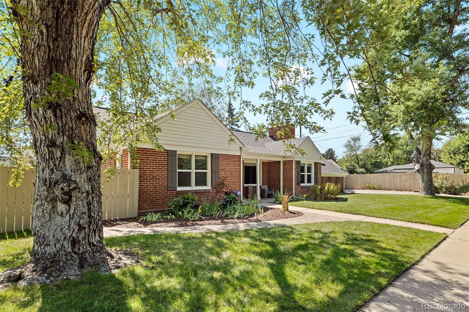 Welcome to the heart of Montclair — one of Denver’s most desirable neighborhoods. This 3 bed, 2 bath ranch-style home blends modern upgrades with timeless character. The sun-filled open layout features hardwood floors, a beautifully updated kitchen with quartz countertops, and spacious living areas designed for both entertaining and everyday comfort.

Step outside and discover a truly stunning yard — mature trees, professional landscaping, and a covered patio create the perfect retreat for Colorado evenings or weekend gatherings. The fully fenced outdoor space is ideal for pets, play, and relaxation, offering privacy and beauty in every season.

Located in Montclair, you’ll enjoy tree-lined streets, welcoming neighbors, and close access to Lowry, Cherry Creek, and neighborhood parks. With its single-level living, outdoor charm, and unbeatable location, this home is move-in ready and waiting for its next chapter. This home has a brand new roof, newly finished Hardwood Floors, newly stained fence, and updated lighting.