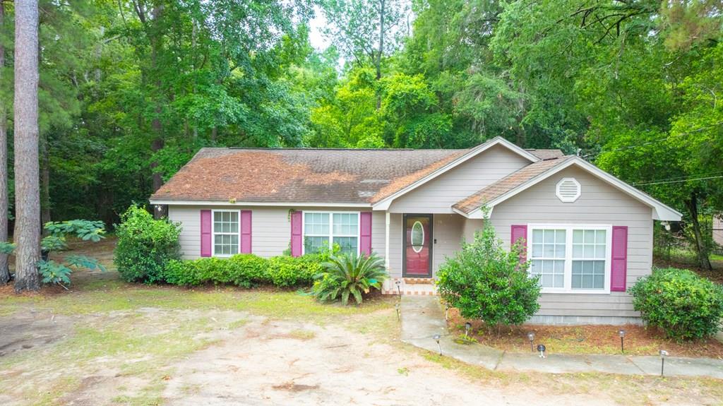 Welcome to easy Southern living! Built in 2004, this beautifully maintained 3-bedroom, 2-bathroom home offers the ultimate blend of style, function, and convenience. Situated on a manageable 0.17-acre lot just two miles from historic downtown Thomasville, you'll enjoy quick access to the city's iconic brick-paved streets, premier shopping, and award-winning dining—without the burden of endless weekend yard work. The home is built on a solid slab foundation and features durable, seamless tile and laminate flooring throughout! The open floor plan features the family room, dining room, and flows effortlessly into a spacious kitchen boasting an abundance of counter space, plentiful cabinet storage, and a dedicated indoor laundry room. The primary suite is a true standout, featuring a generous walk-in closet and an attached primary bathroom equipped with a large double-sink vanity. Step out back onto the brand-newly built back deck! It's the perfect spot for morning coffee, weekend grilling, or relaxing in your low-maintenance backyard. Wrapped in durable Hardie Board siding, the home's exterior is designed to withstand the elements beautifully for years to come. Whether you are a first-time homebuyer, looking to downsize, or seeking a rock-solid investment property, this home is a must-see! Schedule an appointment to see it today!