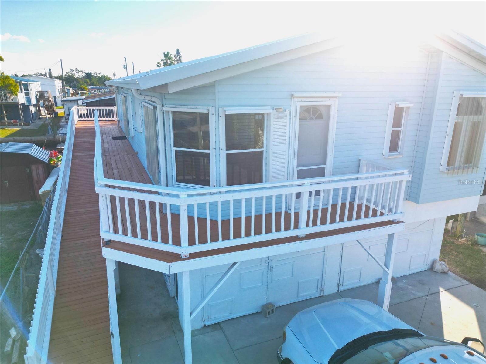 WATERFRONT home on DEEP canal just a SHORT distance to the OPEN GULF OF AMERICA (please view attached virtual tour #1). Here is where you can enjoy the SALT LIFE of going out fishing on your boat, fishing off your dock in your own backyard, kayaking, paddle boarding, admiring dolphin and manatee passing by, the beautiful wild bird life along with the awesome evening SUNSETS! . AC 2020, Metal roof and hurricane shutters. You will love the 3 sided wrap around balcony w/covered screened in patio overlooking the water for morning coffee or evening cocktails. This 3 bedroom, 2 full bath is light and bright!  The nice open kitchen features accented frosted cabinets with an eat-in area looking out the bay window and an inside closet laundry.  The large primary bedroom has an oversized tub, walk-in shower and dual sinks. The roomy open living room/dining room with an electric cozy fireplace is great for family fun and entertaining.  The garage is the full size of the home approx. 46' X 20' where you can enjoy a Man-cave sports area, store your water toys, antique cars, workshop and plenty of extra storage.  All this is located in a very friendly golf cart fishing community where you have a very short ride to waterfront restaurants/bars, ice-cream shops, shopping, hospital, library and so much more.  It is also conveniently located approx.45 minutes from the airports, professional sports entertainment along with famous Clearwater Beach. Come enjoy this unique life style!